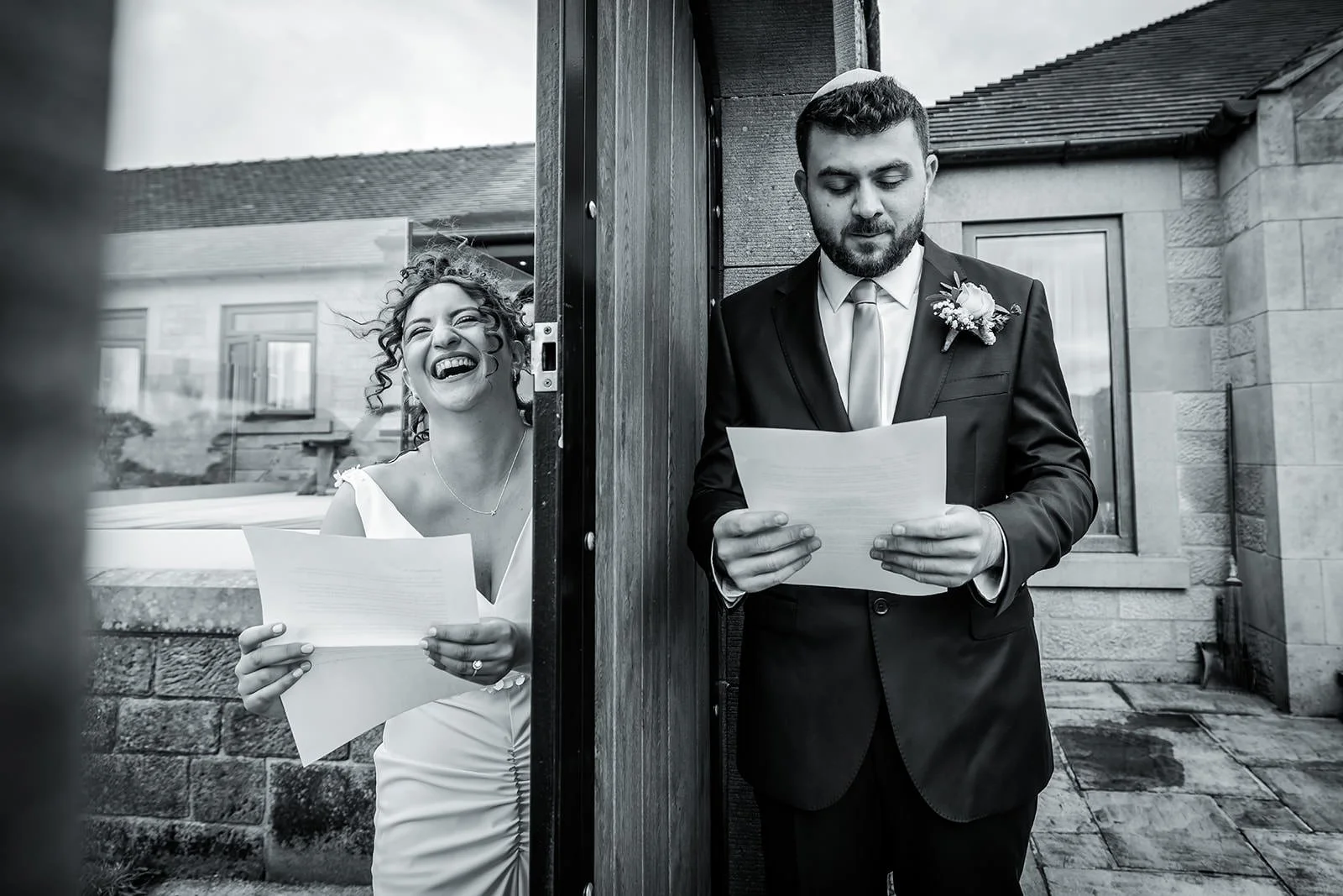 groom and bride exchange letters in secret garden at heaton house farm in macclesfield