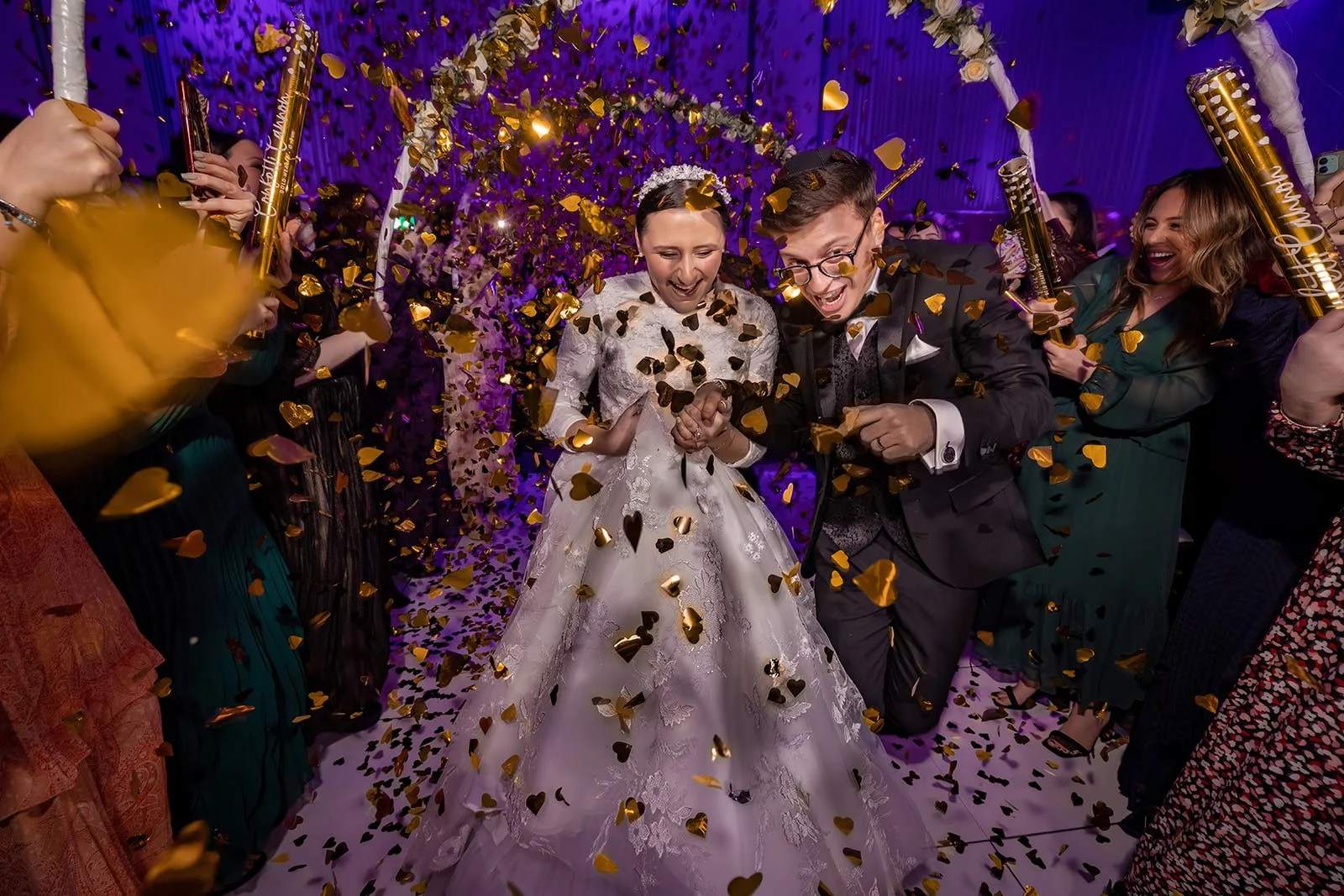 bride and groom make entrance with confetti into wedding reception dance floor at manchester deansgate hotel