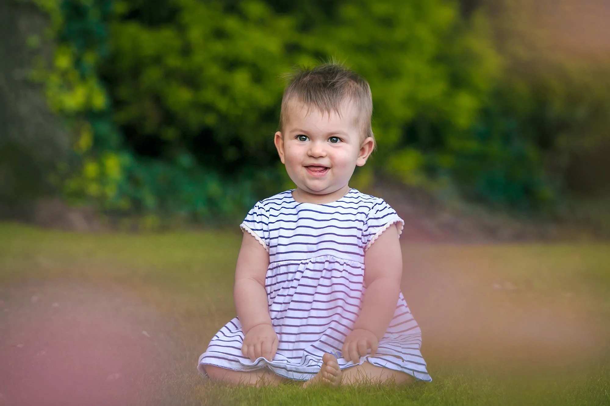 baby portrait sitting in garden