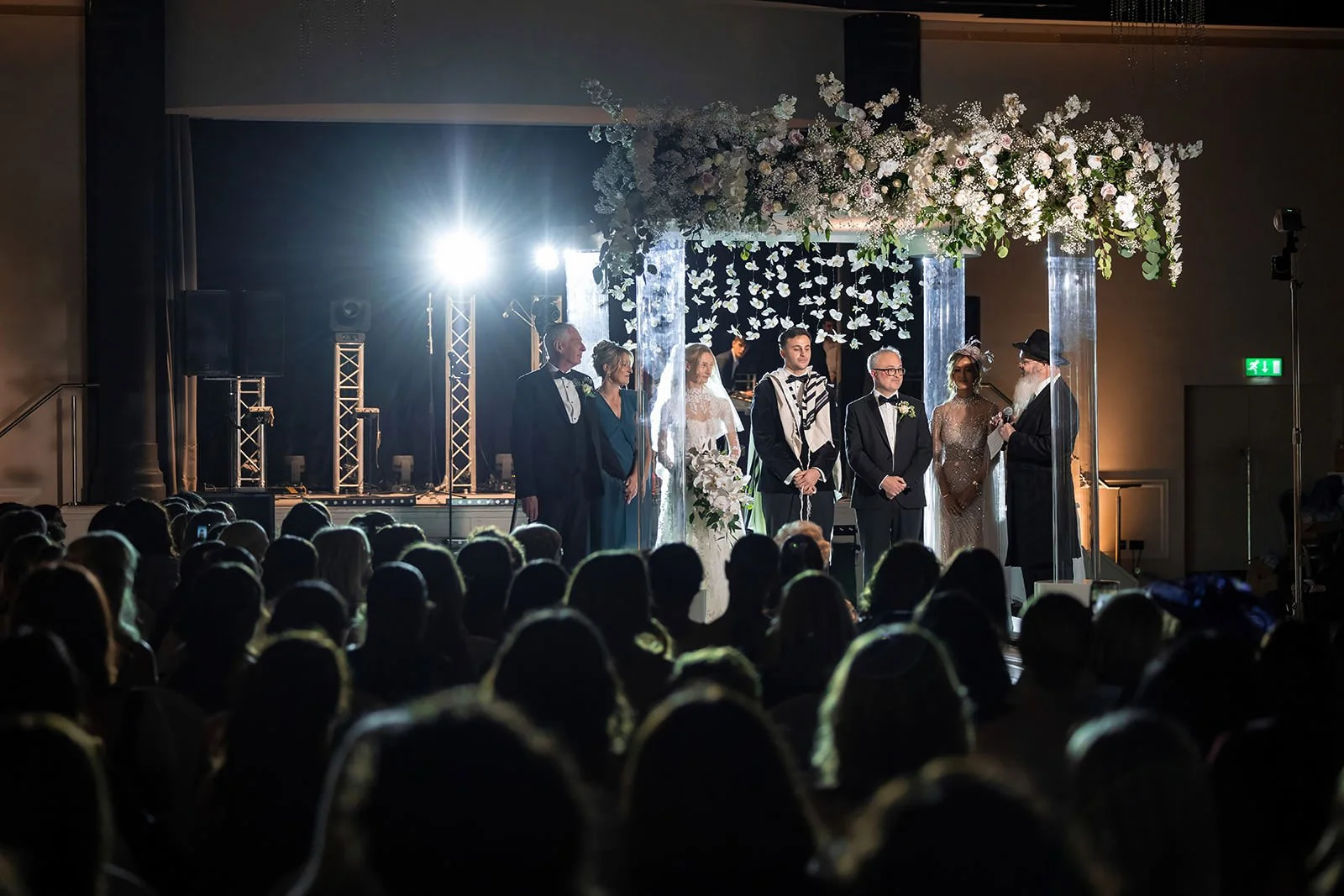 bride and groom exchange vows during wedding ceremony in international suite at mercure manchester piccadilly
