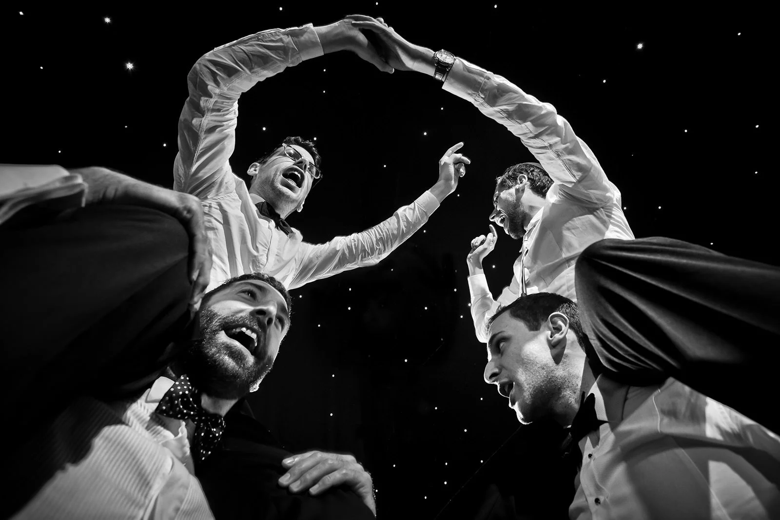 Jewish wedding photography in Manchester with a jewish groom on shoulders dancing on the dance floor