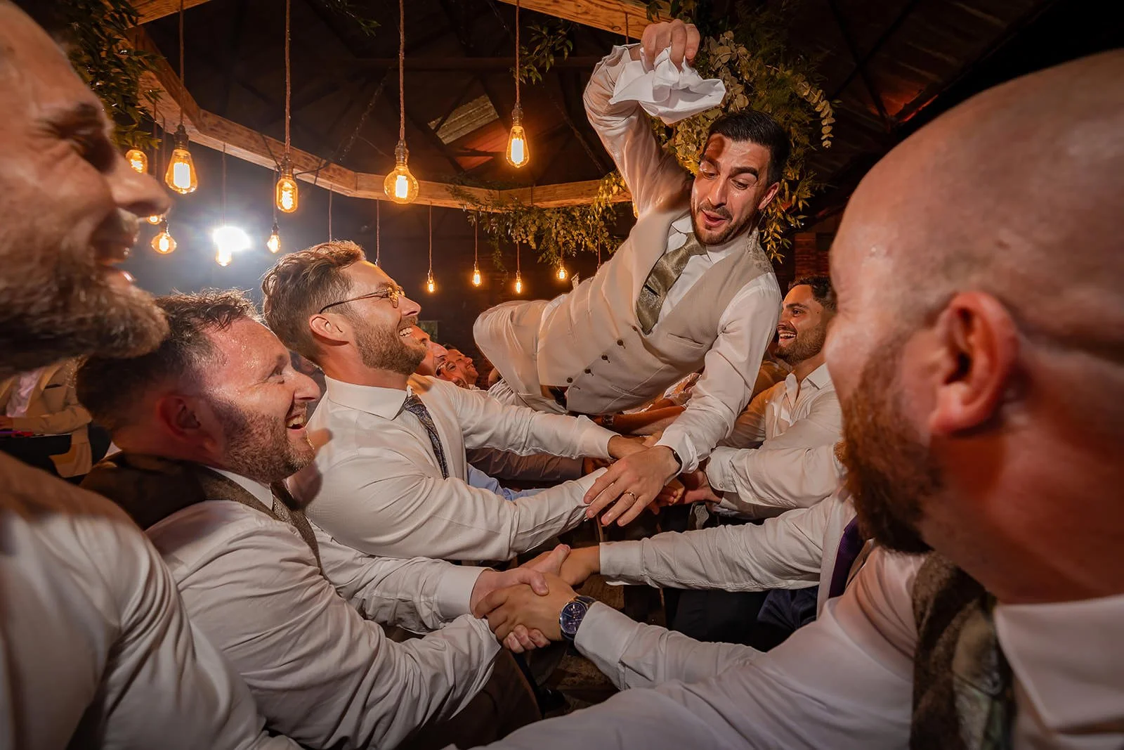 groom thrown in air during reception party at white syke fields in yorkshire