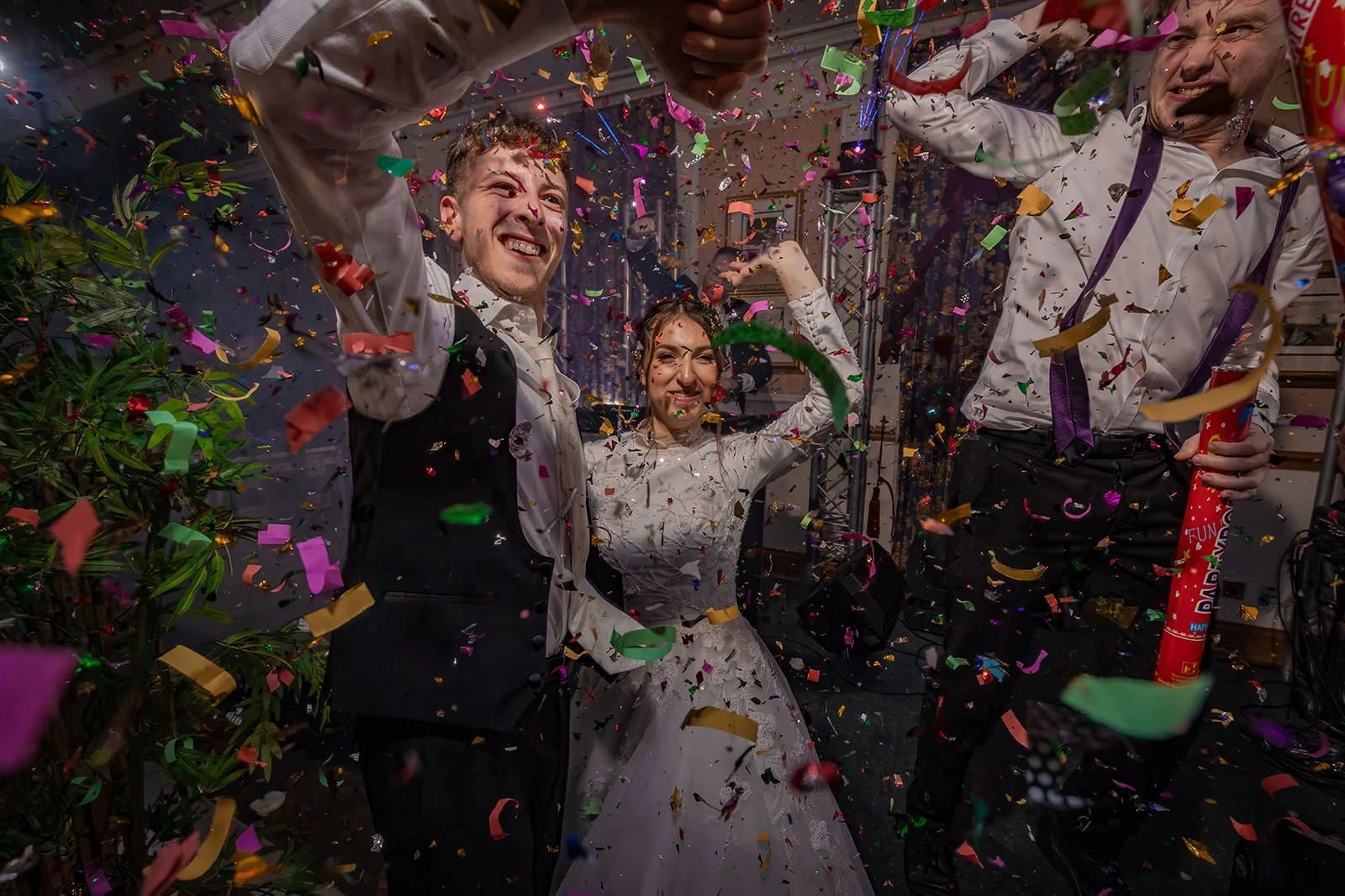 bride and groom make entrance onto dance floor during wedding party reception at last drop village in bolton
