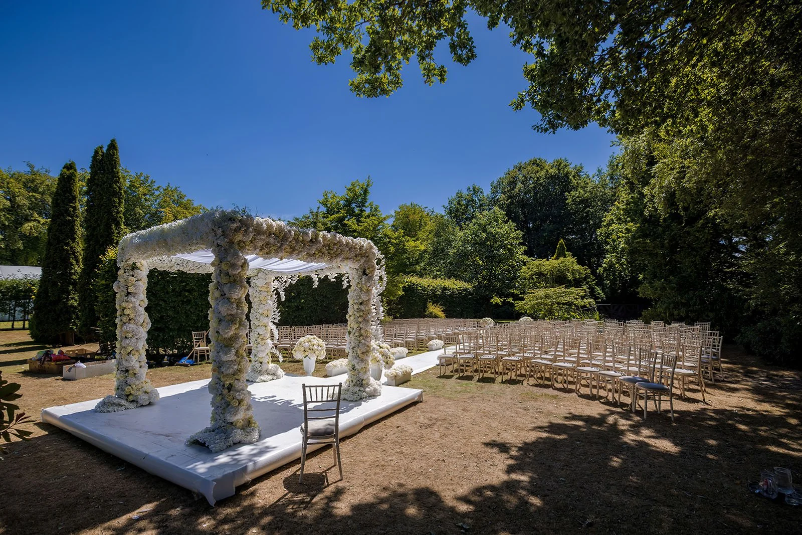 outdoor wedding ceremony set up in Italian gardens at nunsmere hall venue in cheshire