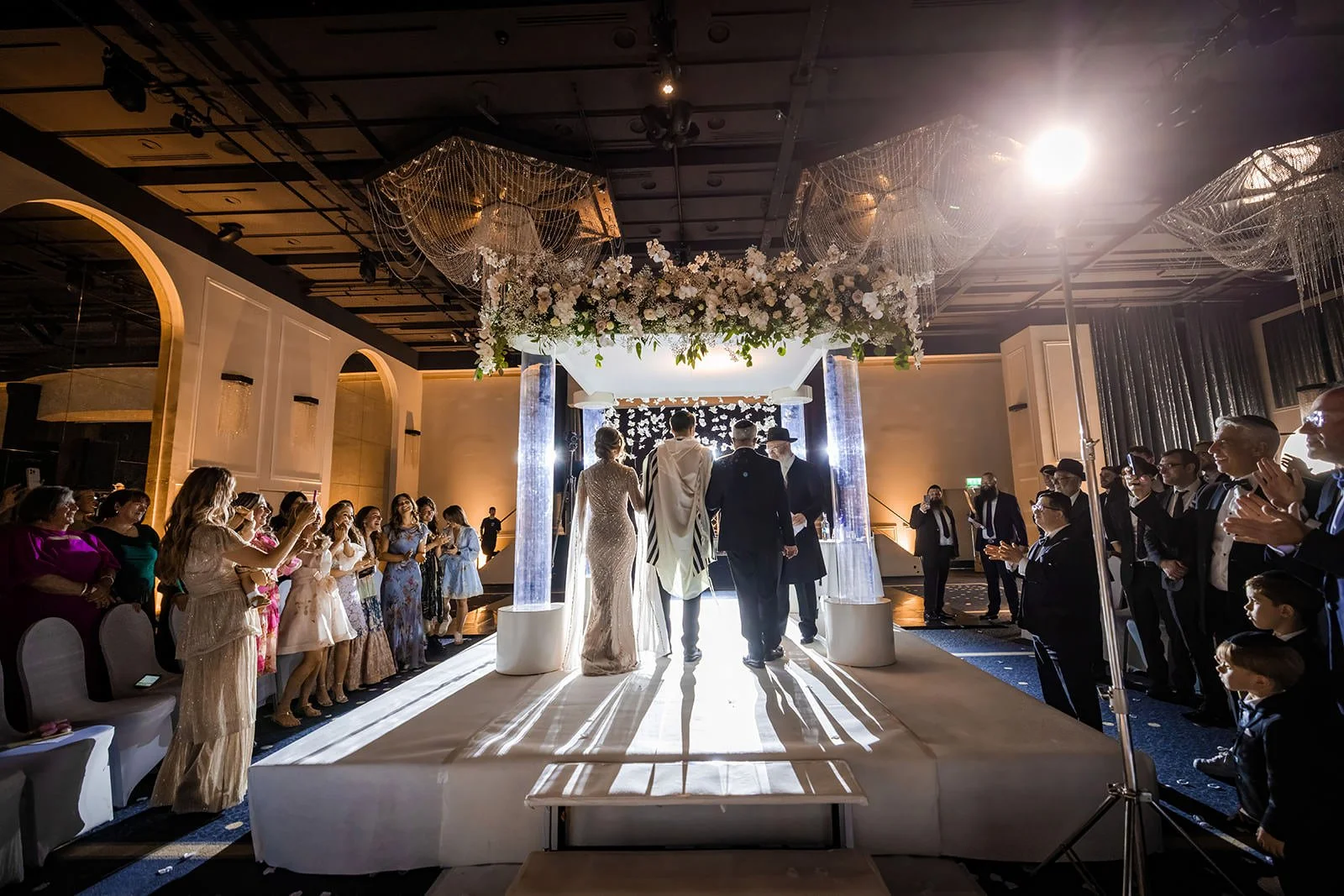 bride and groom exchange vows during wedding ceremony in international suite at mercure manchester piccadilly