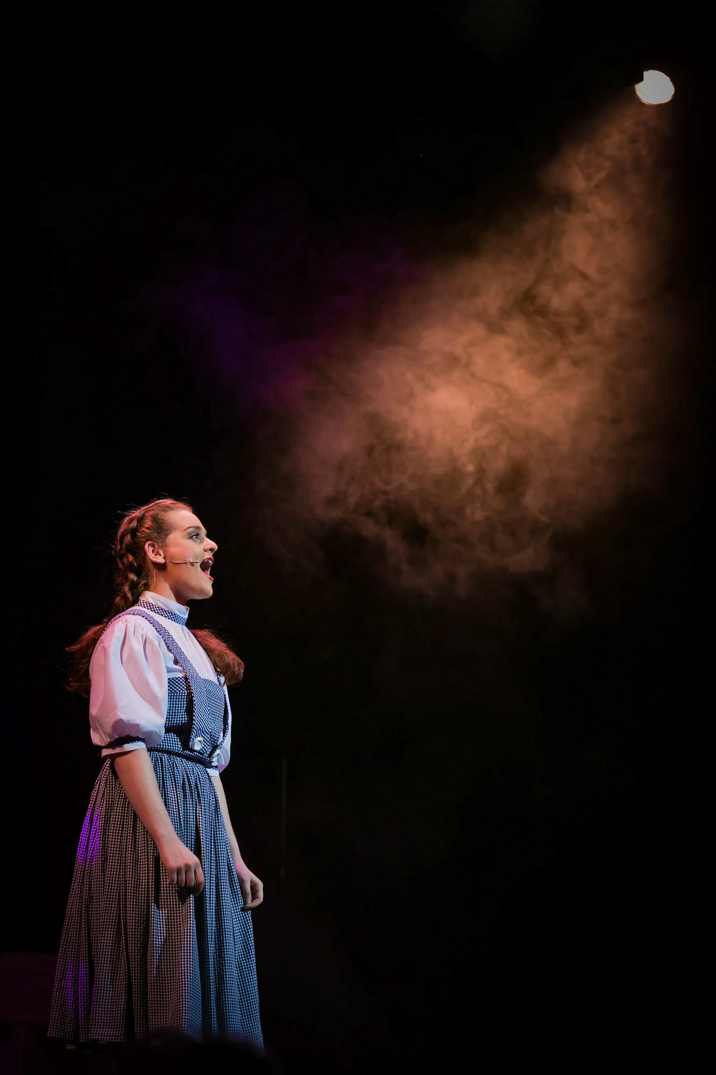 dorothy in wizard of oz production on stage theatre performance dramatic photography portrait with make-up and costume
