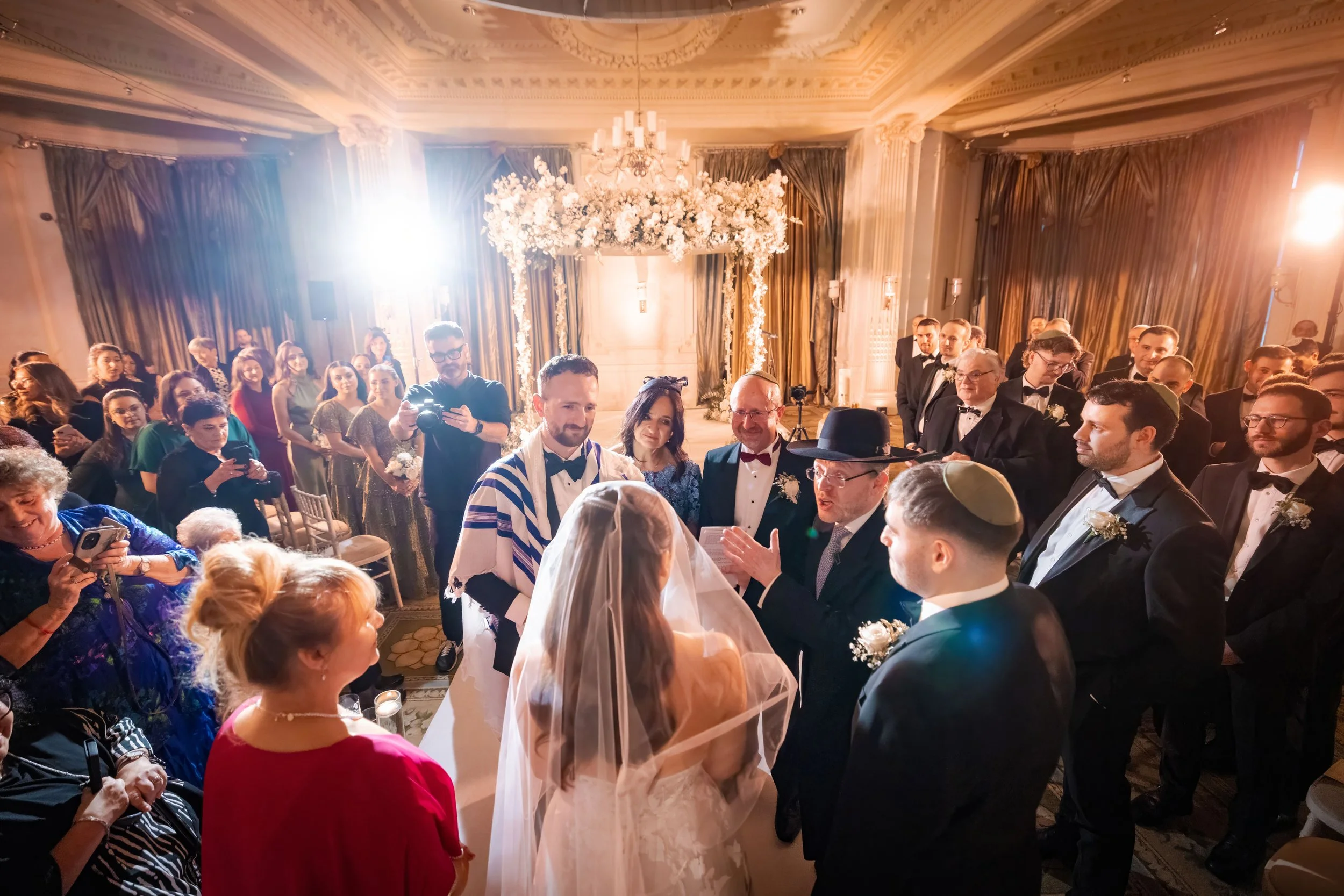 groom and bride at bedeken on the aisle before ceremony, photographed by a jewish manchester wedding photographer