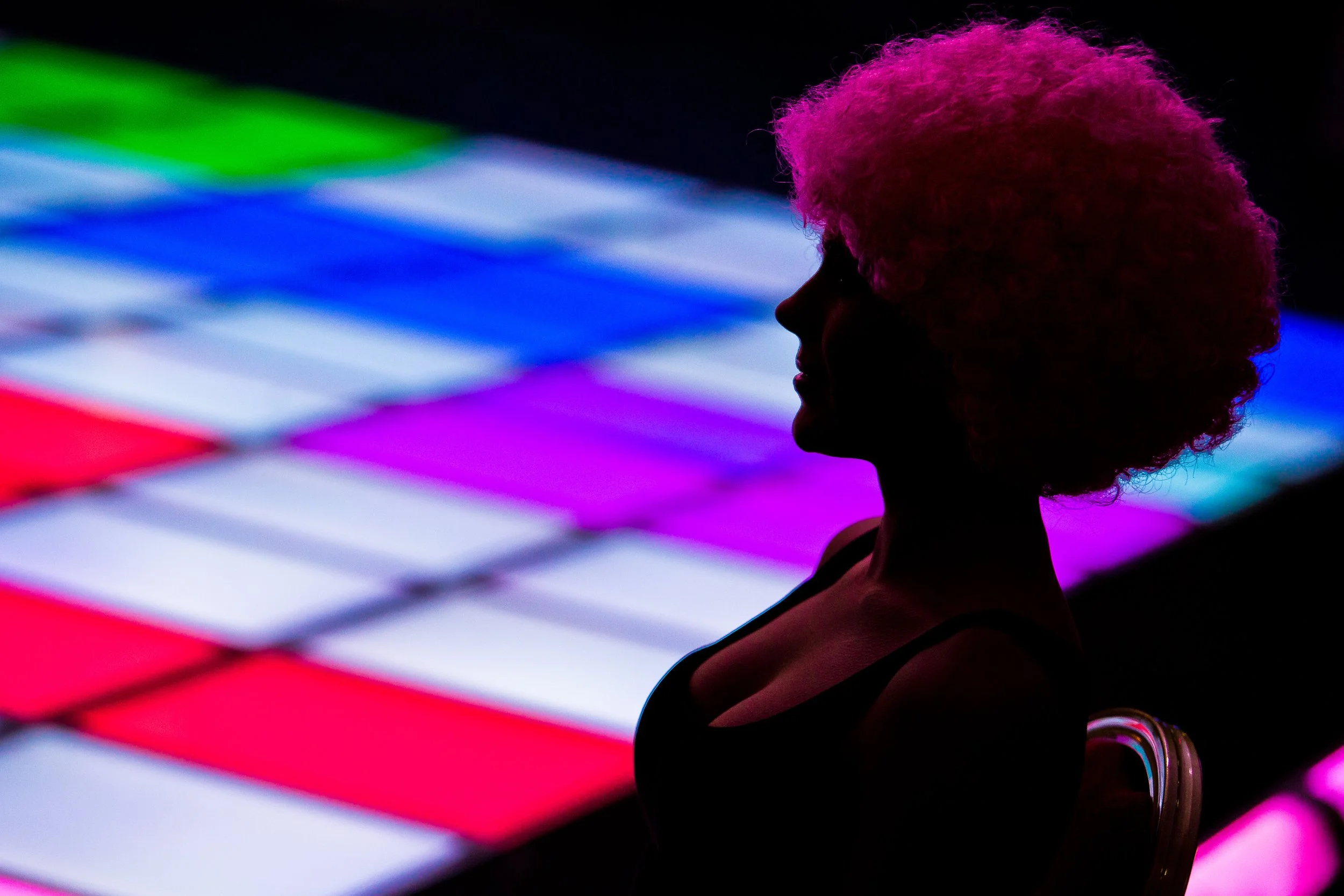 studio 54 themed charity event with silhouette of disco girl with afro