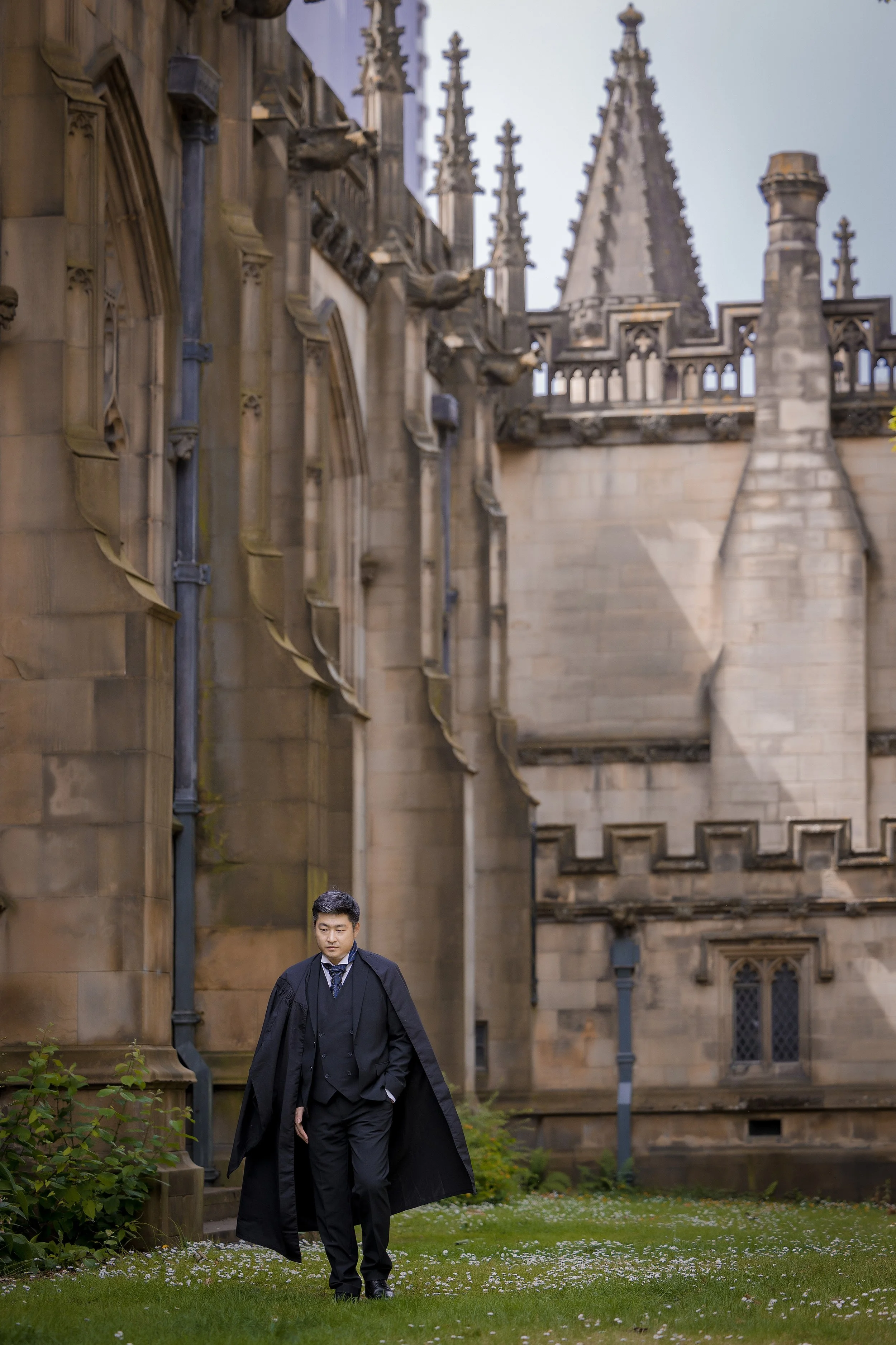 graduation portrait outside manchester cathedral