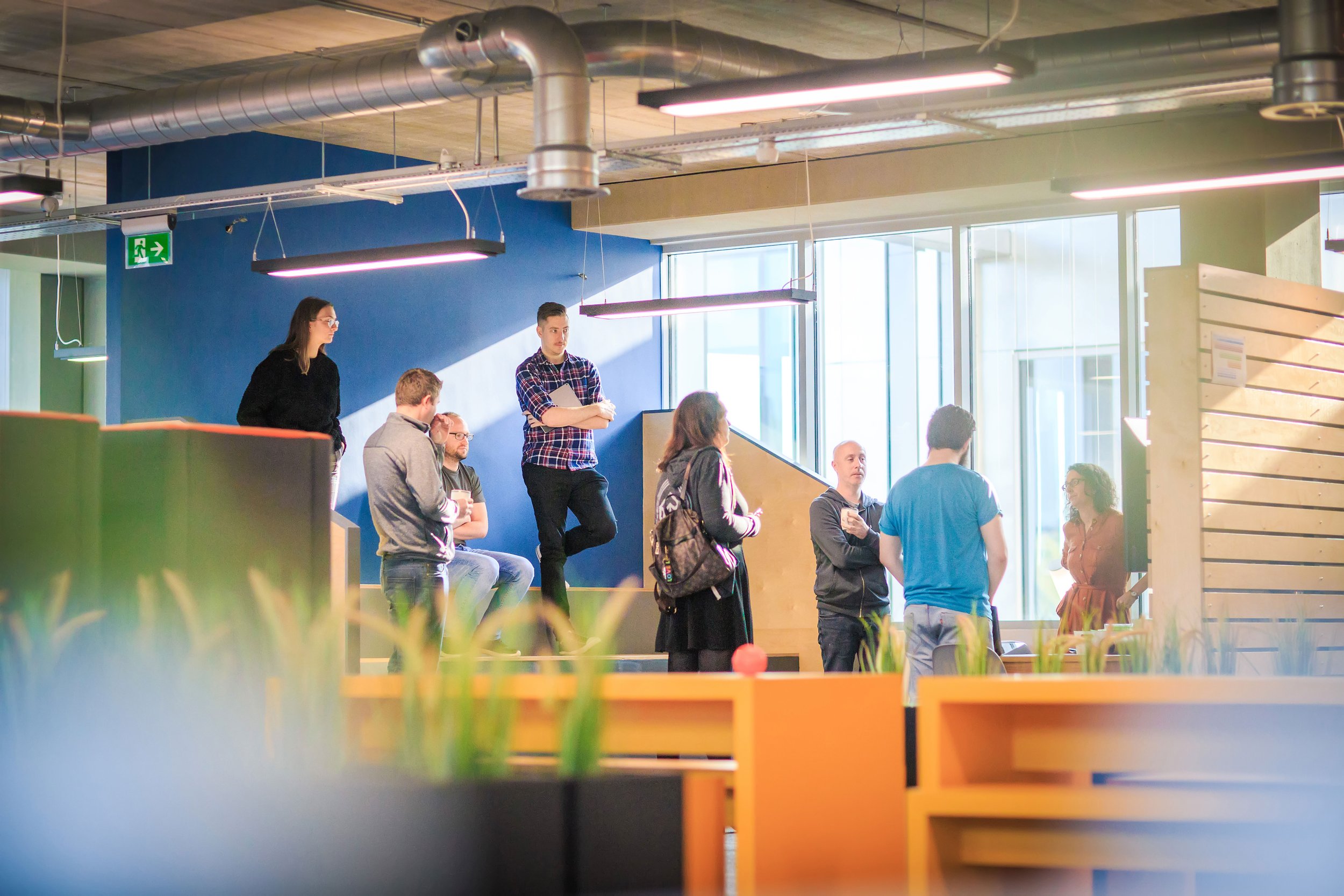 Team meeting taking place in a modern office workspace