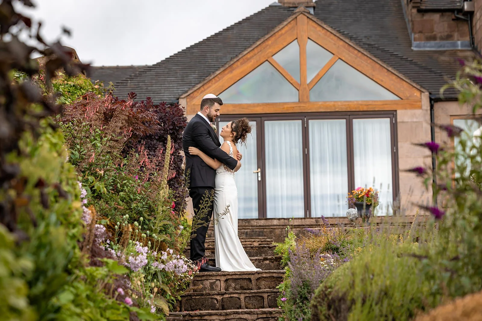 bride groom newlywed couple portrait in secret garden at heaton house farm in macclesfield