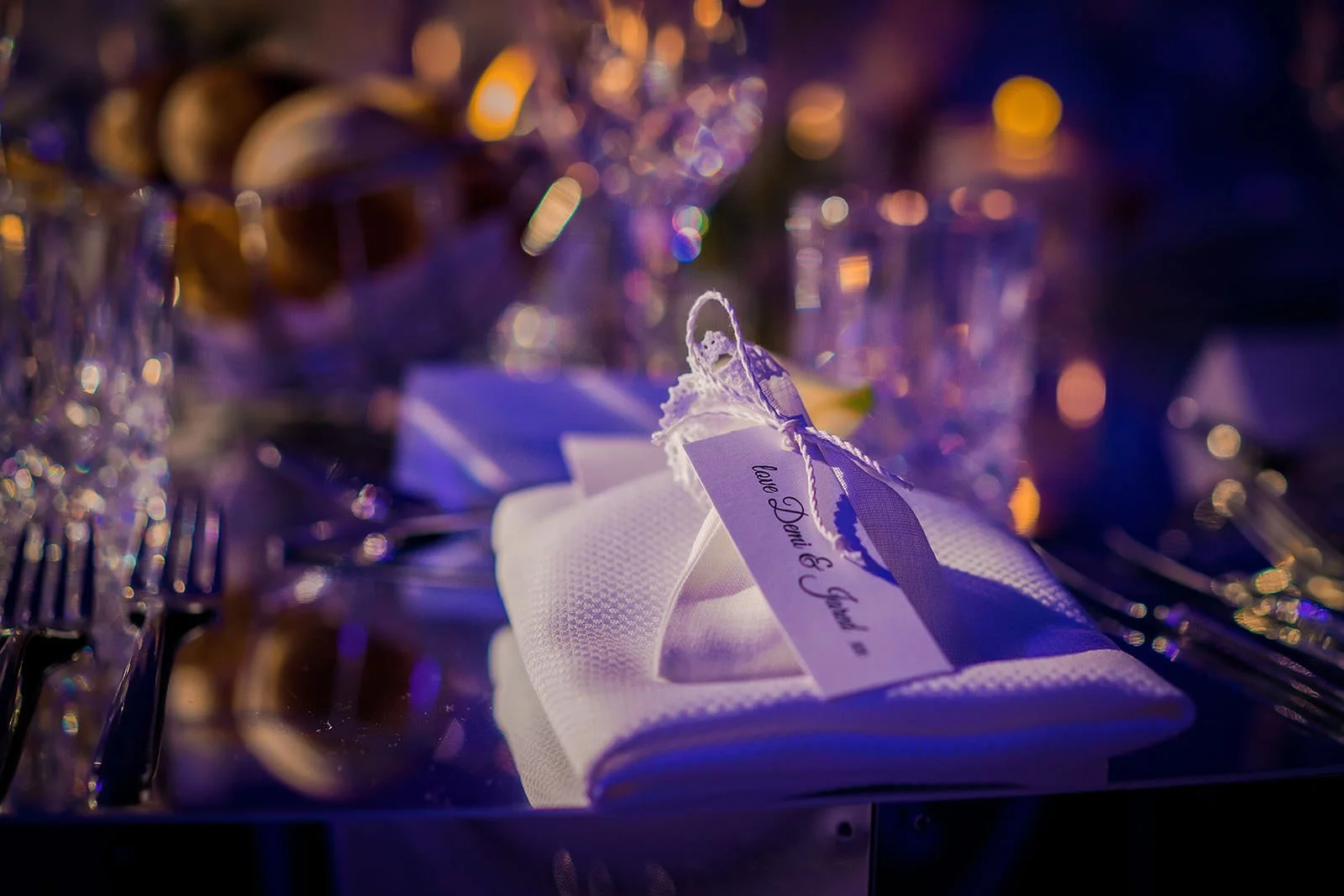 Wedding place card and blue ribbon table detail, Nunsmere Hall reception
