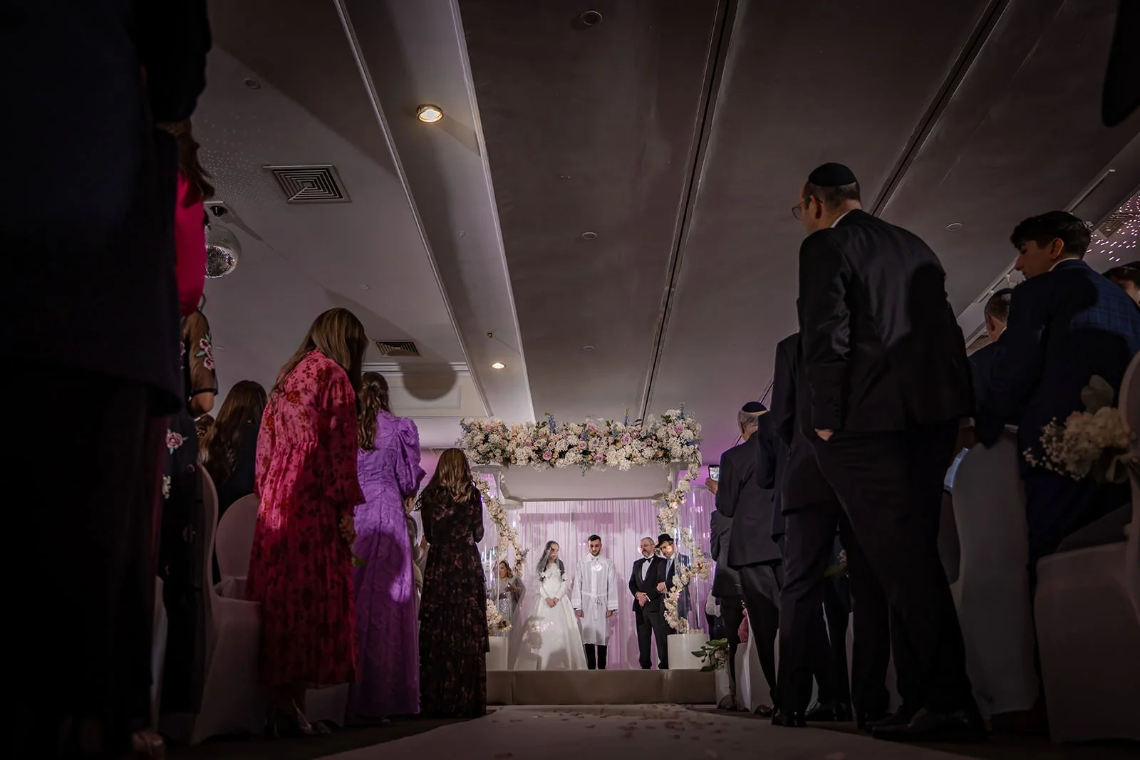 bride and groom exchange vows during indoor wedding ceremony at last drop village in bolton