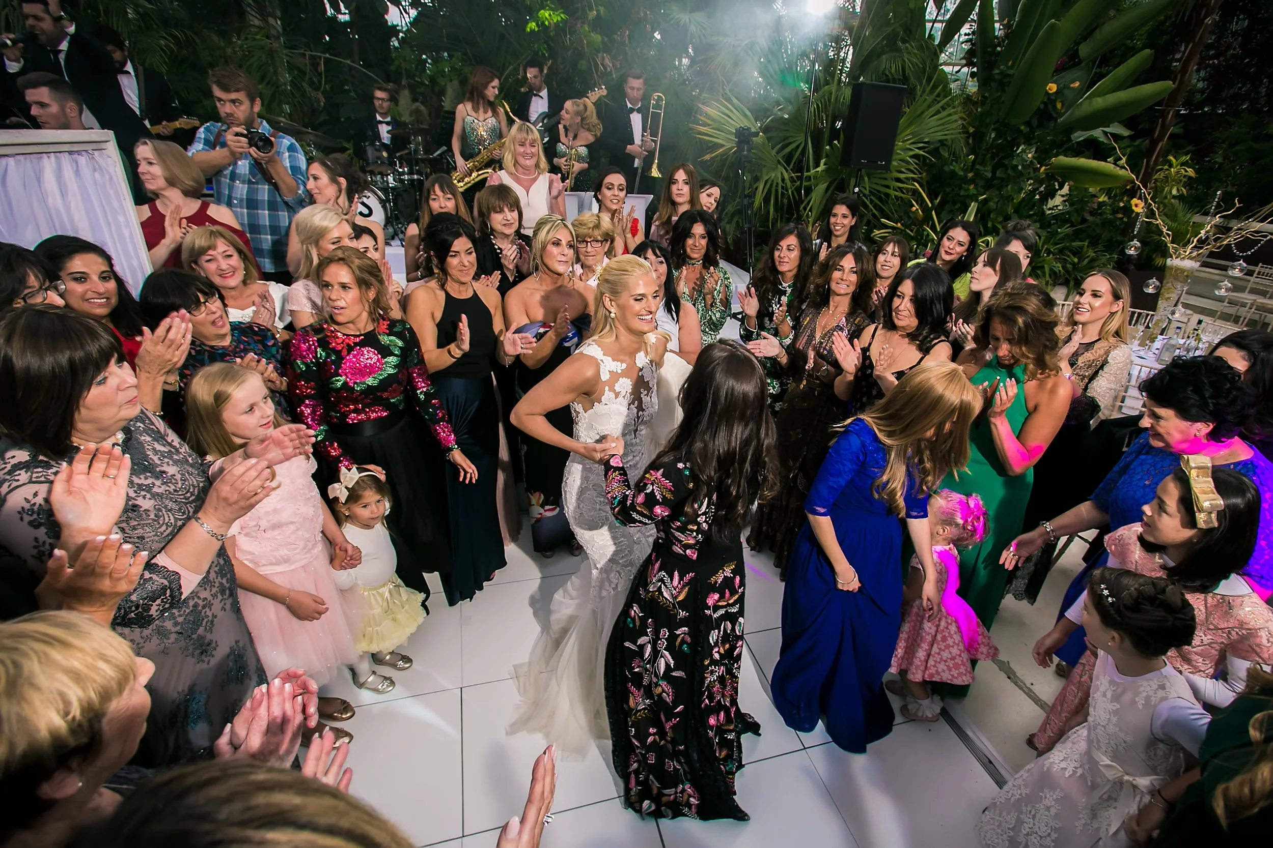 bride dancing at wedding reception at sefton park palm house in liverpool