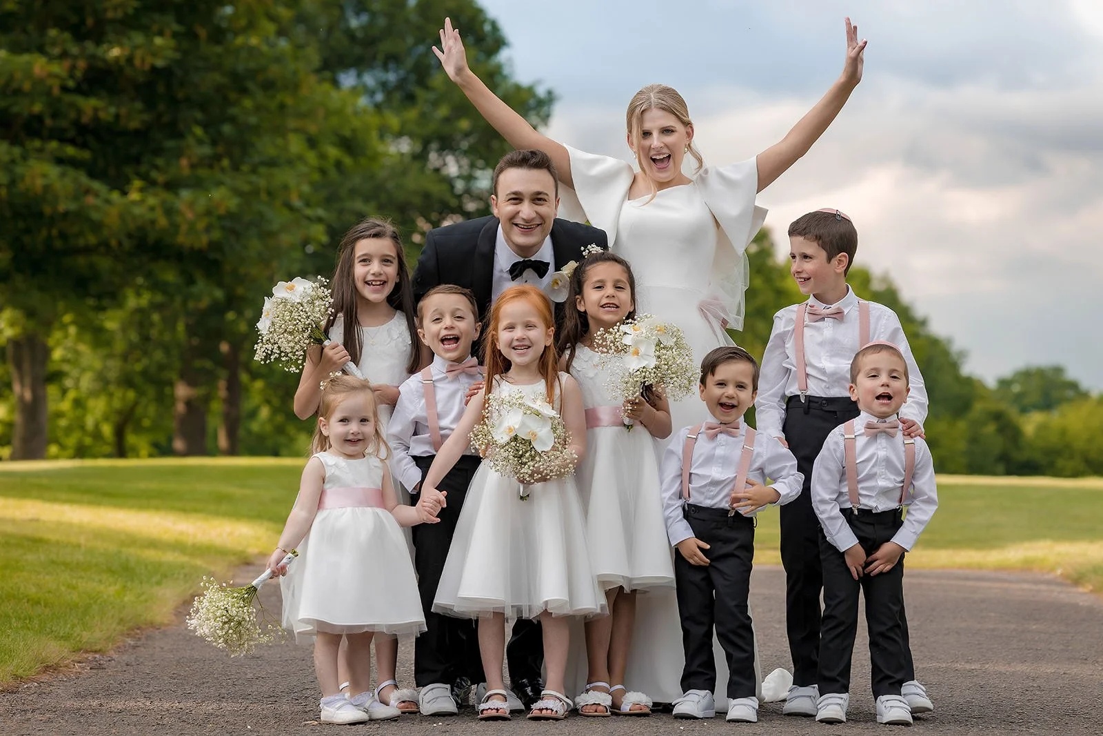 bride and groom and page boys and flower girls portrait during wedding at mere golf resort in cheshire