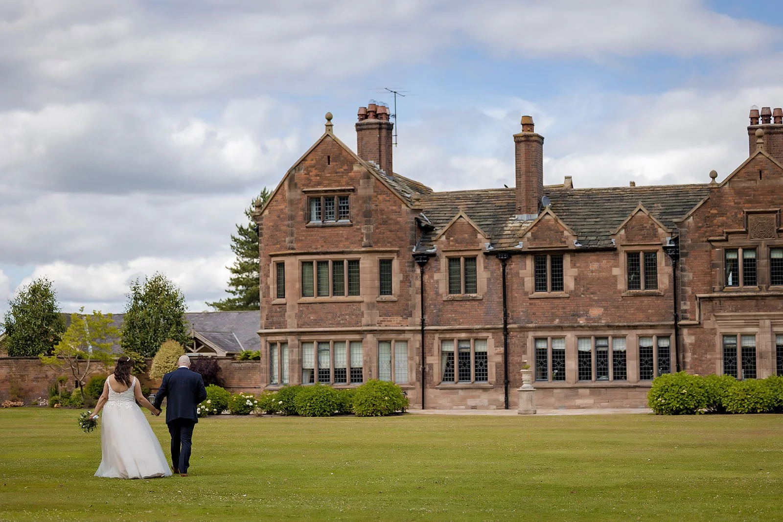 bride and groom portrait with colshaw hall exterior