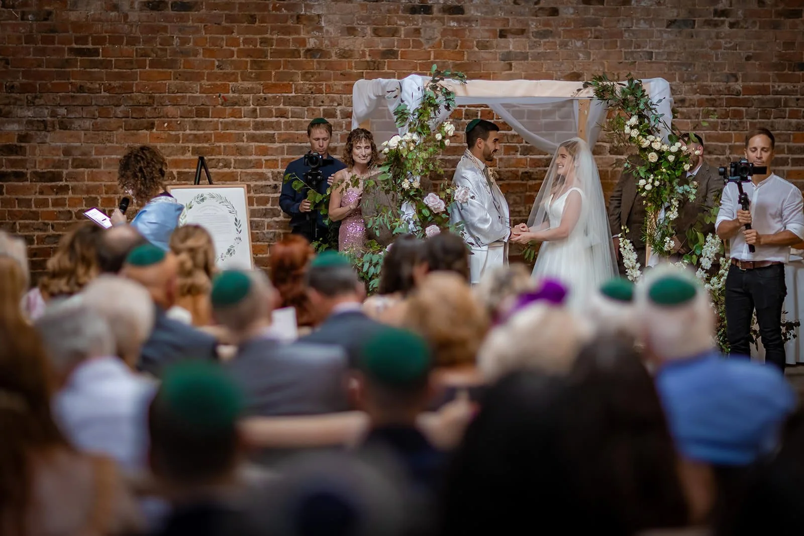 bride and groom exchange during wedding ceremony at white syke fields in yorkshire