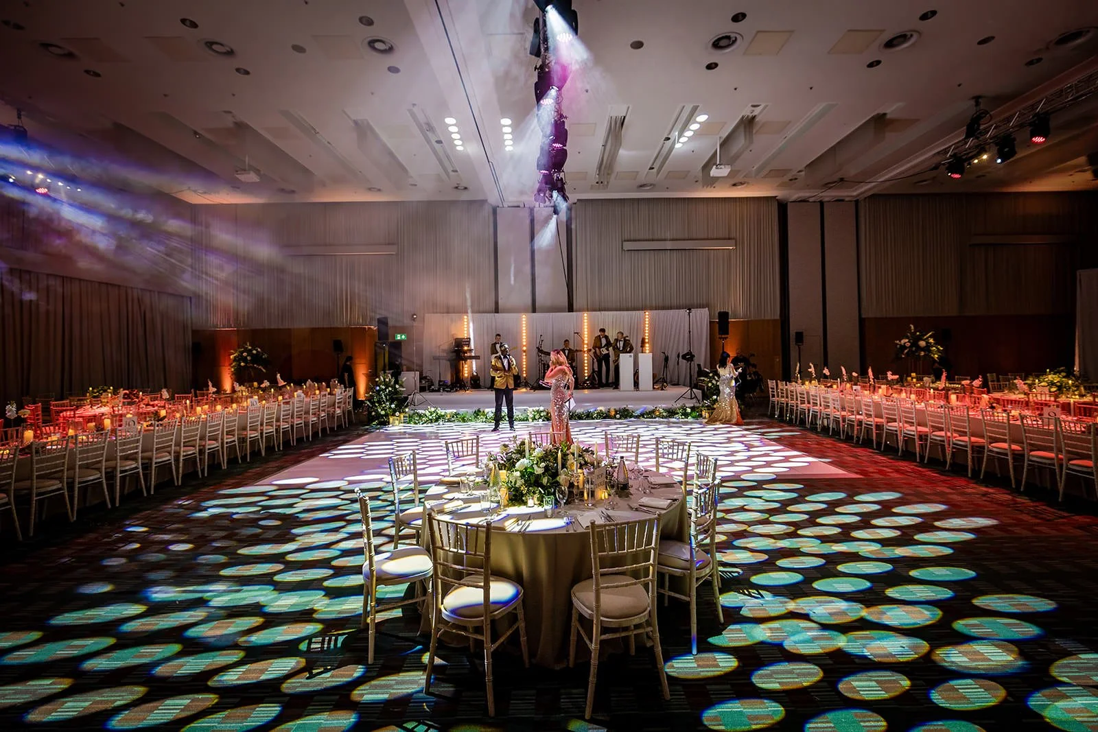 manchester deansgate hotel wedding reception room set up for dinner and dancing with decor and lighting