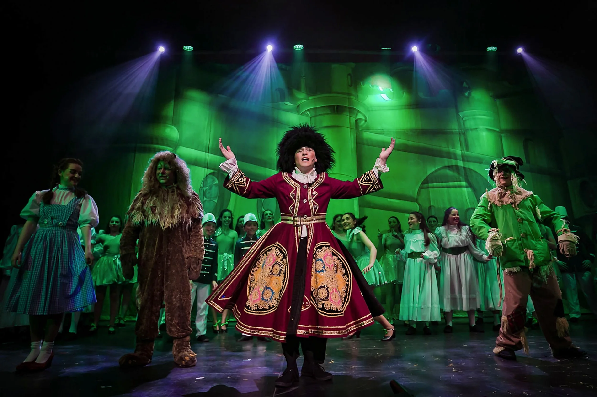 wizard of oz musical stage production photography with lighting and chorus