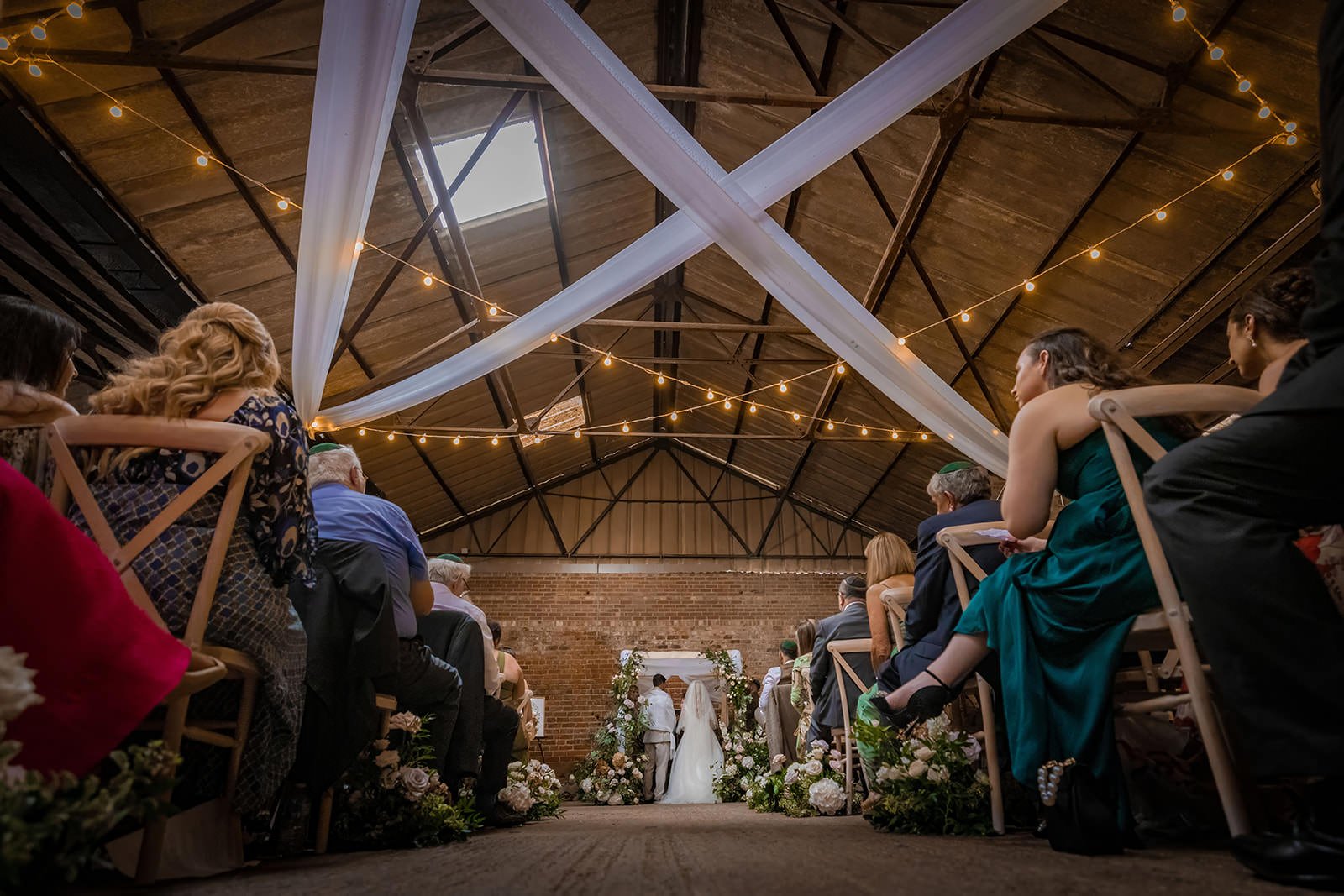 bride and groom exchange during wedding ceremony at white syke fields in yorkshire