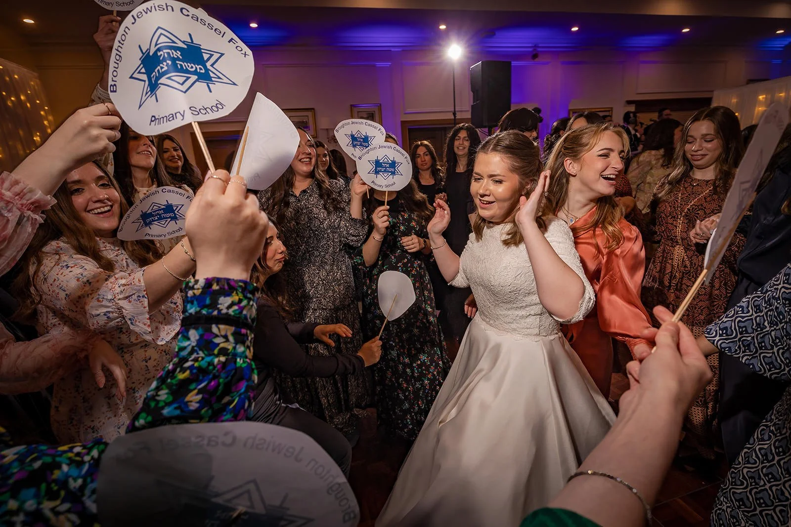 bride and friends during wedding party reception at last drop village in bolton