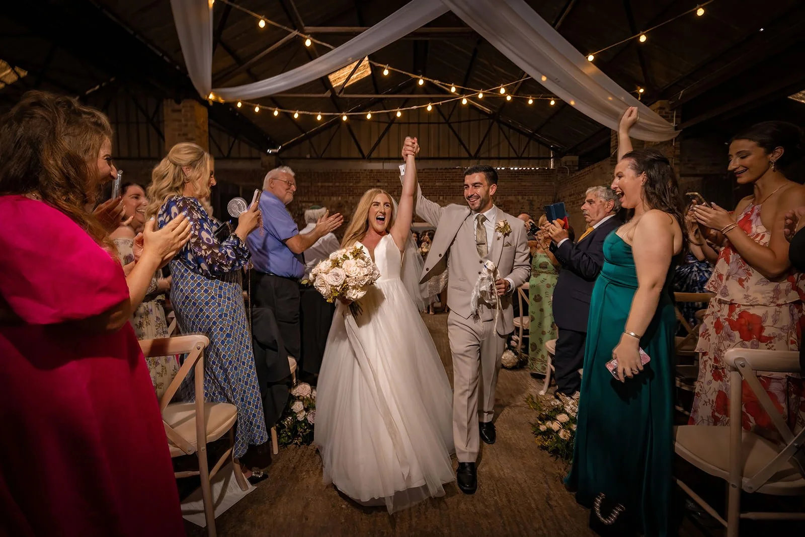 bride and groom leave wedding ceremony at white syke fields in yorkshire