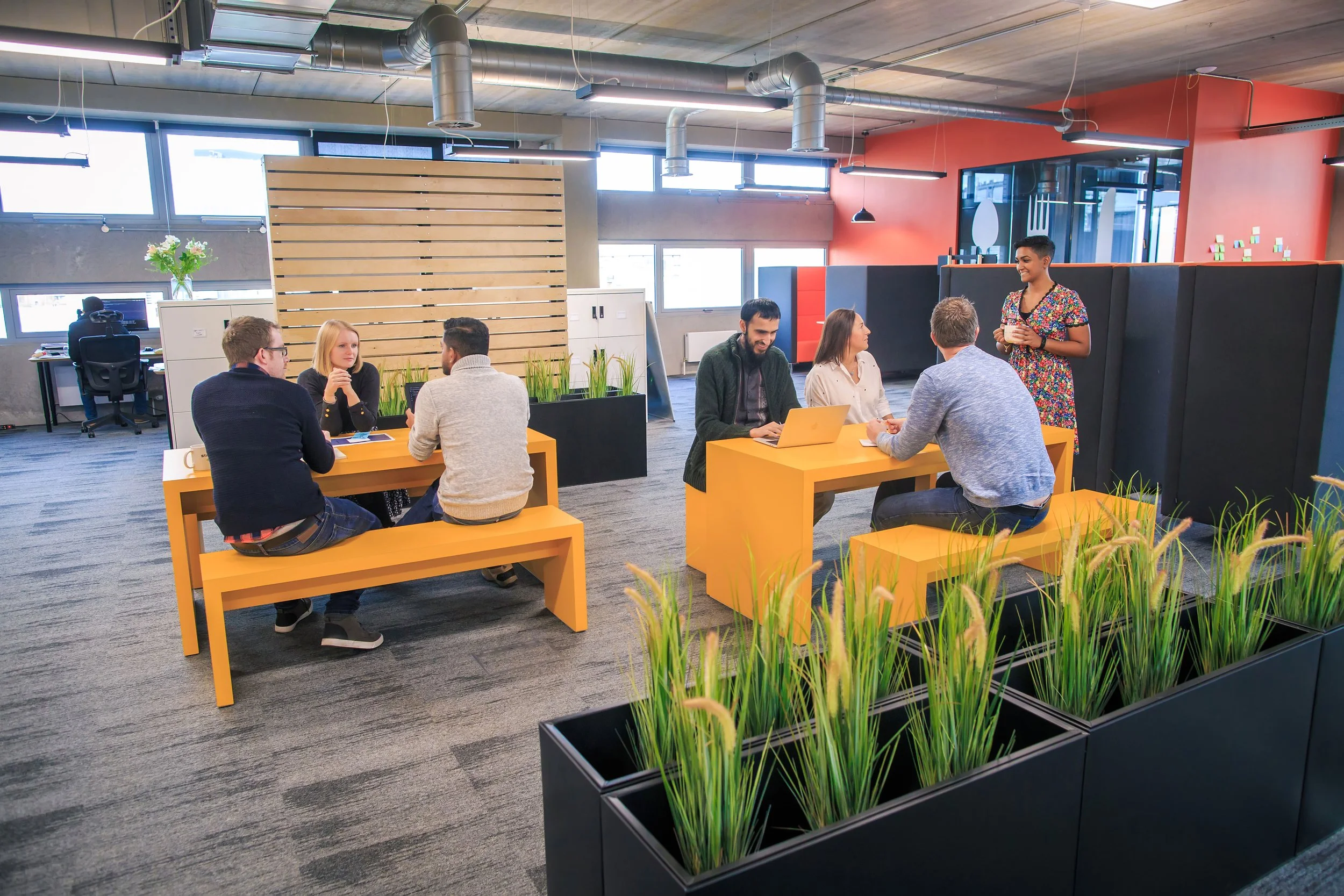 Workplace culture photography showing a team meeting in progress