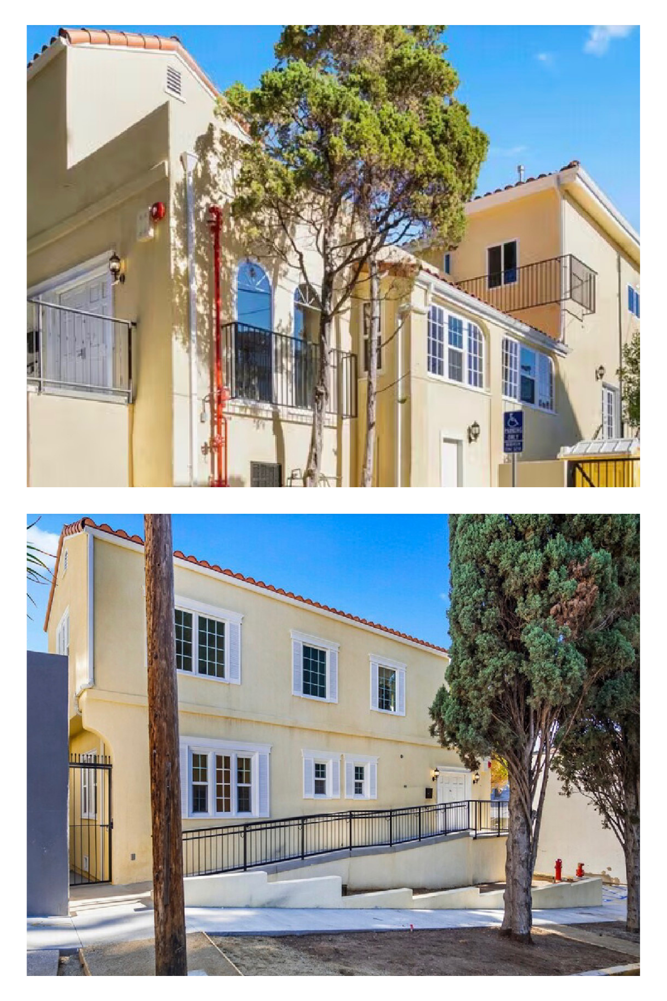 Two multi-story buildings with yellow and cream exterior walls, multiple windows, balconies, and a black metal fence, surrounded by trees and under a clear blue sky.