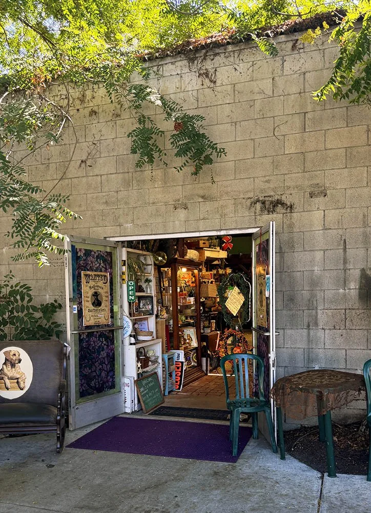 Open double doors in a cinder block wall at Gum's Mall of Antiques in Hawaiian Gardens