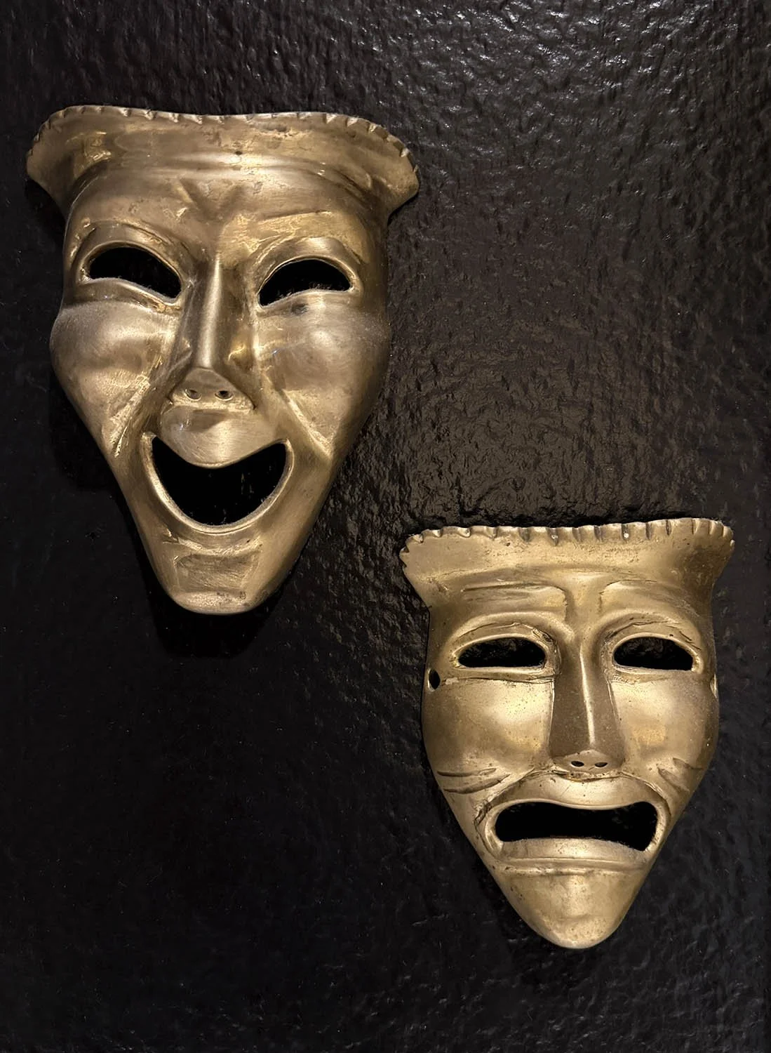 altered-bloom-bathroom-gallery-wall-brass-theater-masks-dark-maximalist.jpg
