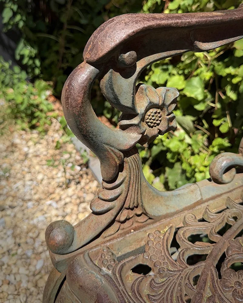 moody-entryway-decor-cast-iron-bench-grapevine-detail.jpg