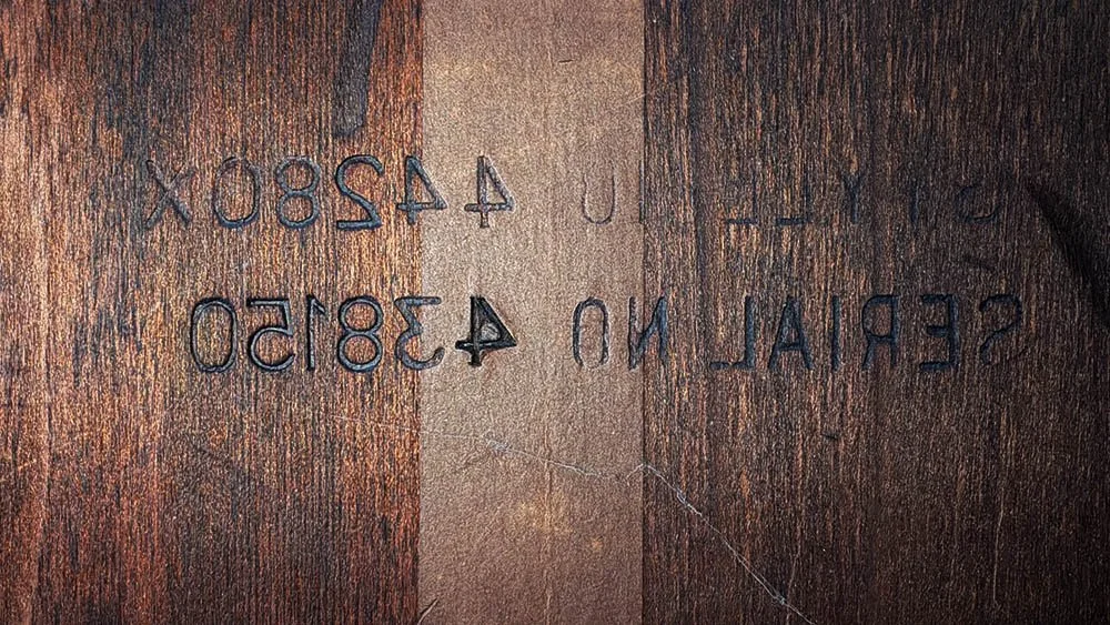 Reversed serial number 438150 stamped on the underside of a Lane cedar chest
