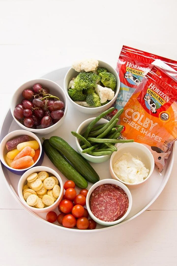 🥒🌈 Summer Snack Series ☀️

Snack boards aren't just for grown-ups! Fill a plate with colorful veggies, crackers, cheese cubes, fruit, and a favorite dip like hummus or ranch. Giving kids choices can help them explore new foods and listen to their b