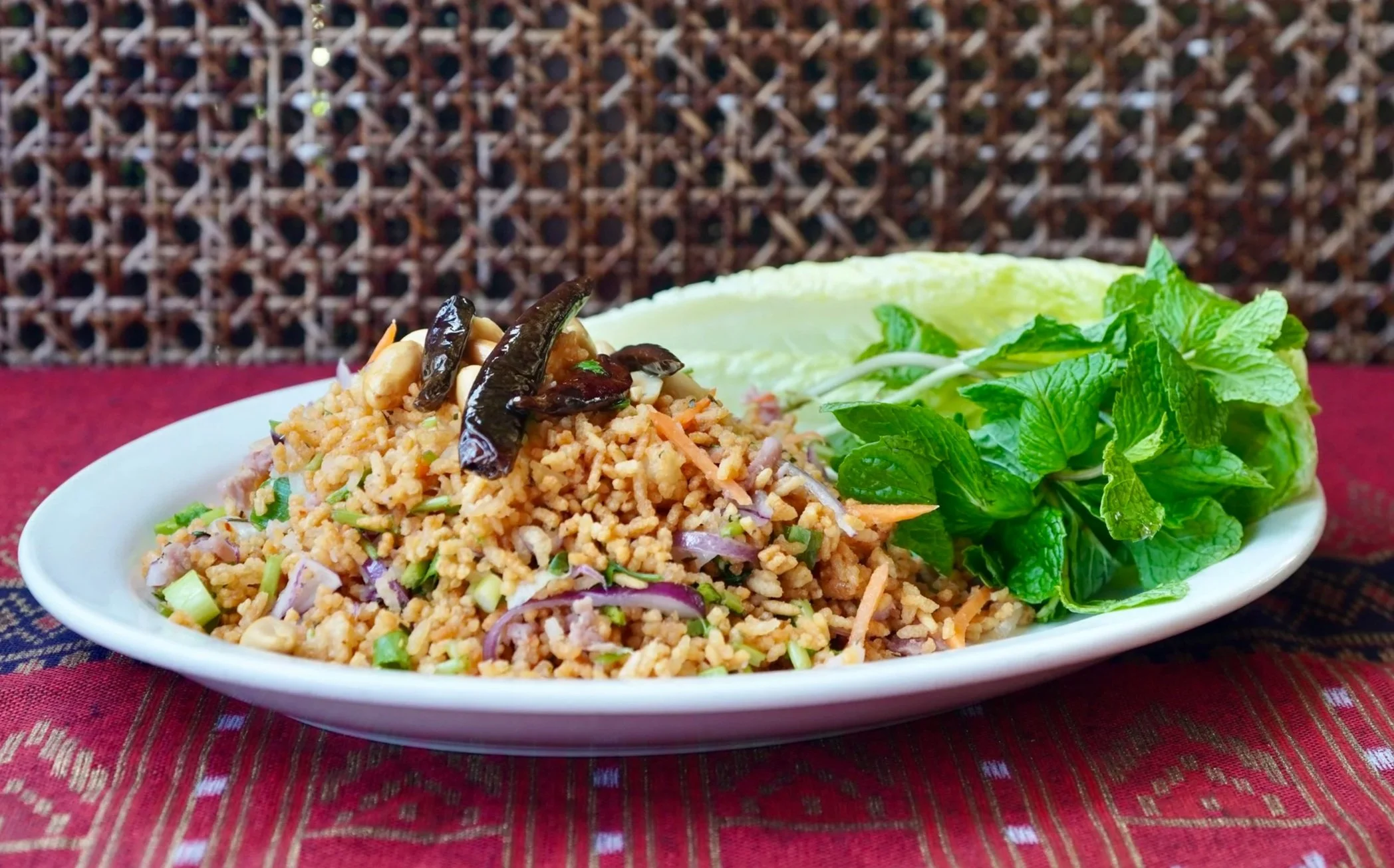 Our Thai-style Fried Rice-- jasmine rice, eggs, soy sauce, tomatoes, onions, and your choice of meat.