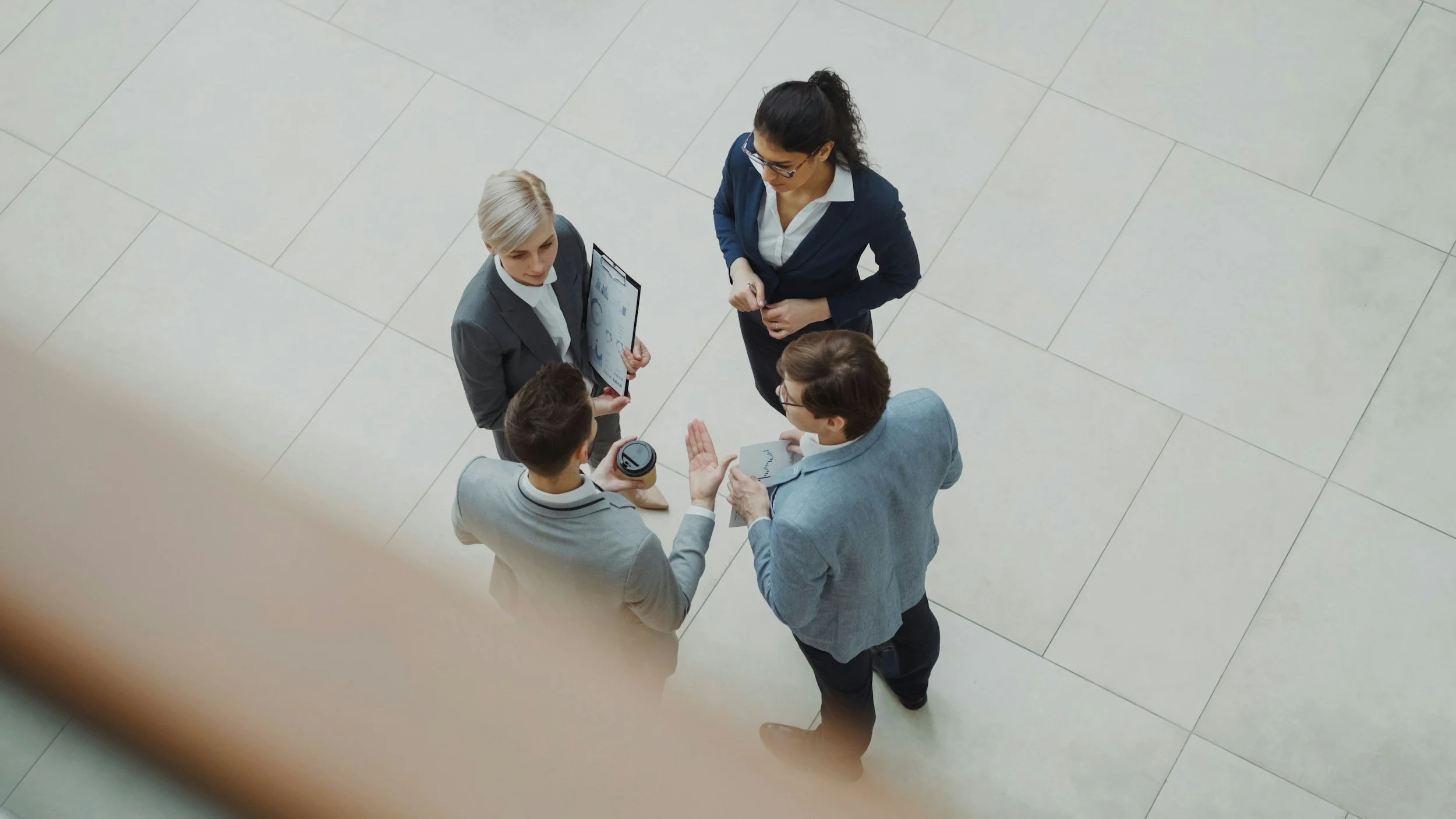 4 people discussing business
