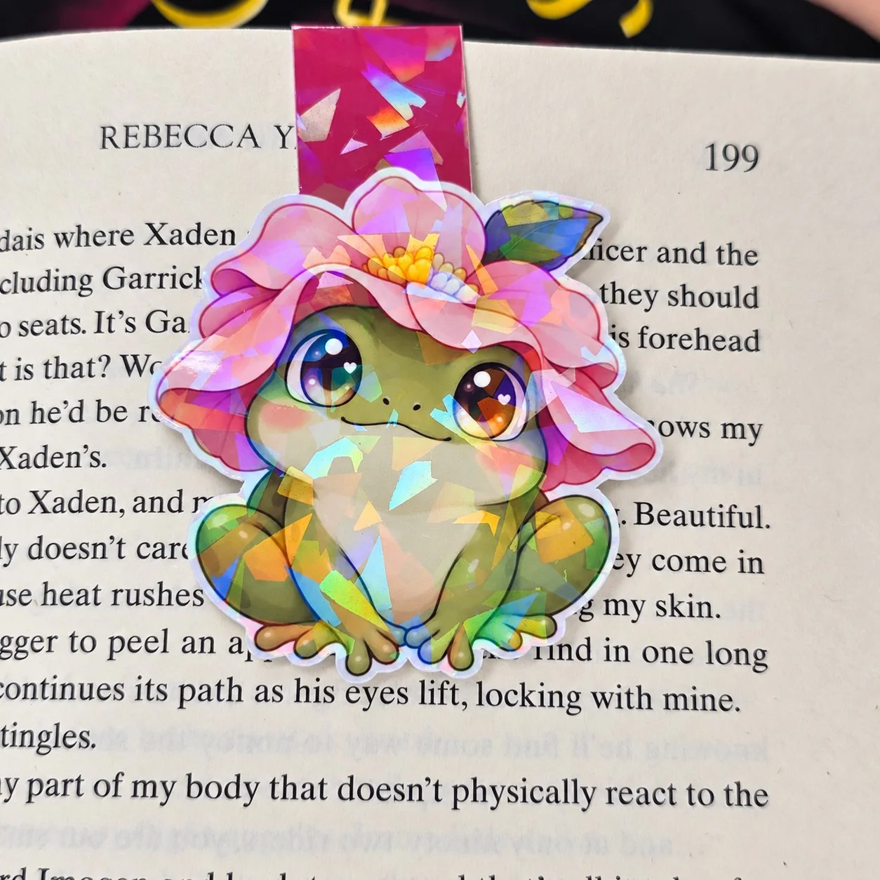 Holographic double-sided magnetic bookmark featuring a green frog wearing a pink flower hat, with a coordinating pink tab.