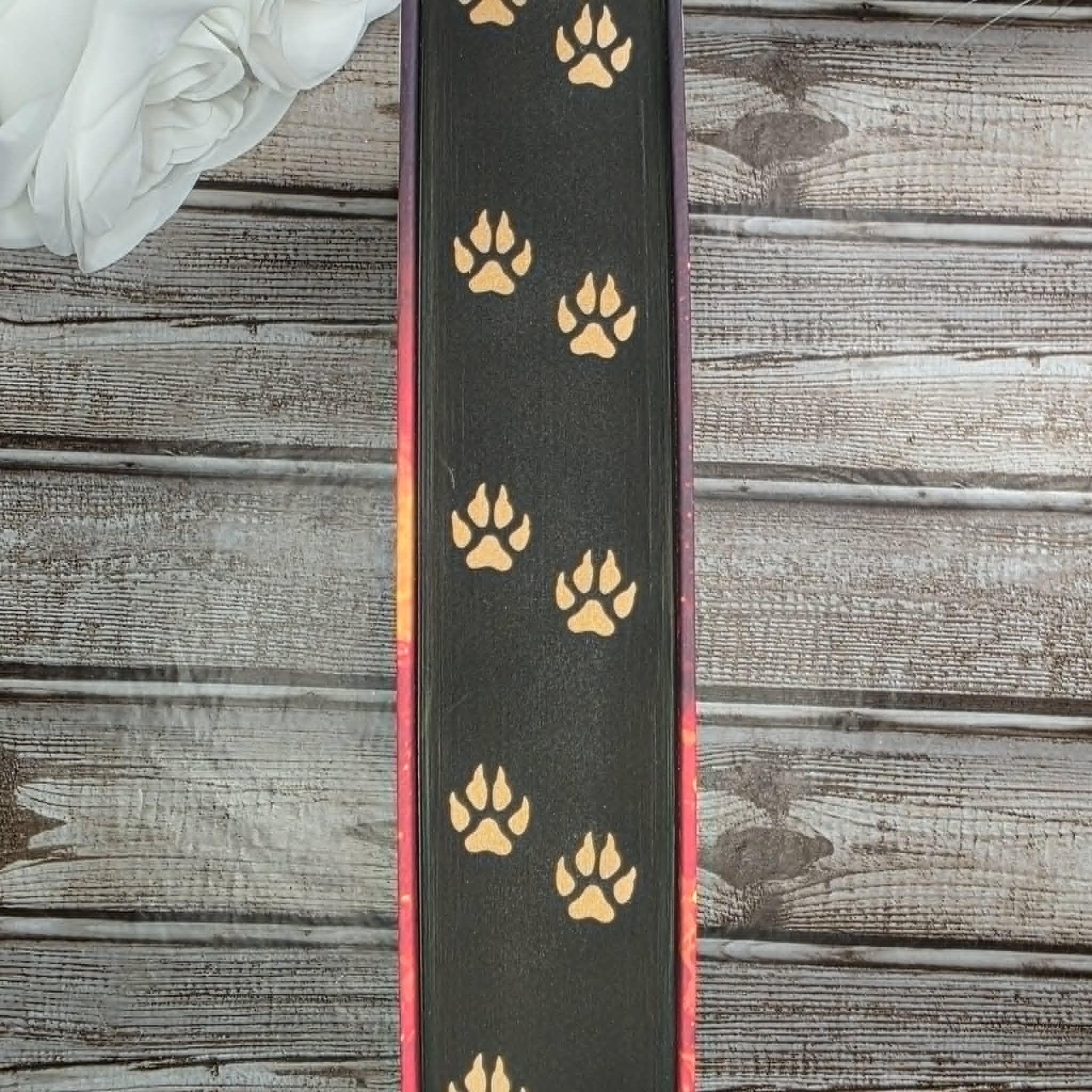 Black sprayed book edges with gold fox footprints