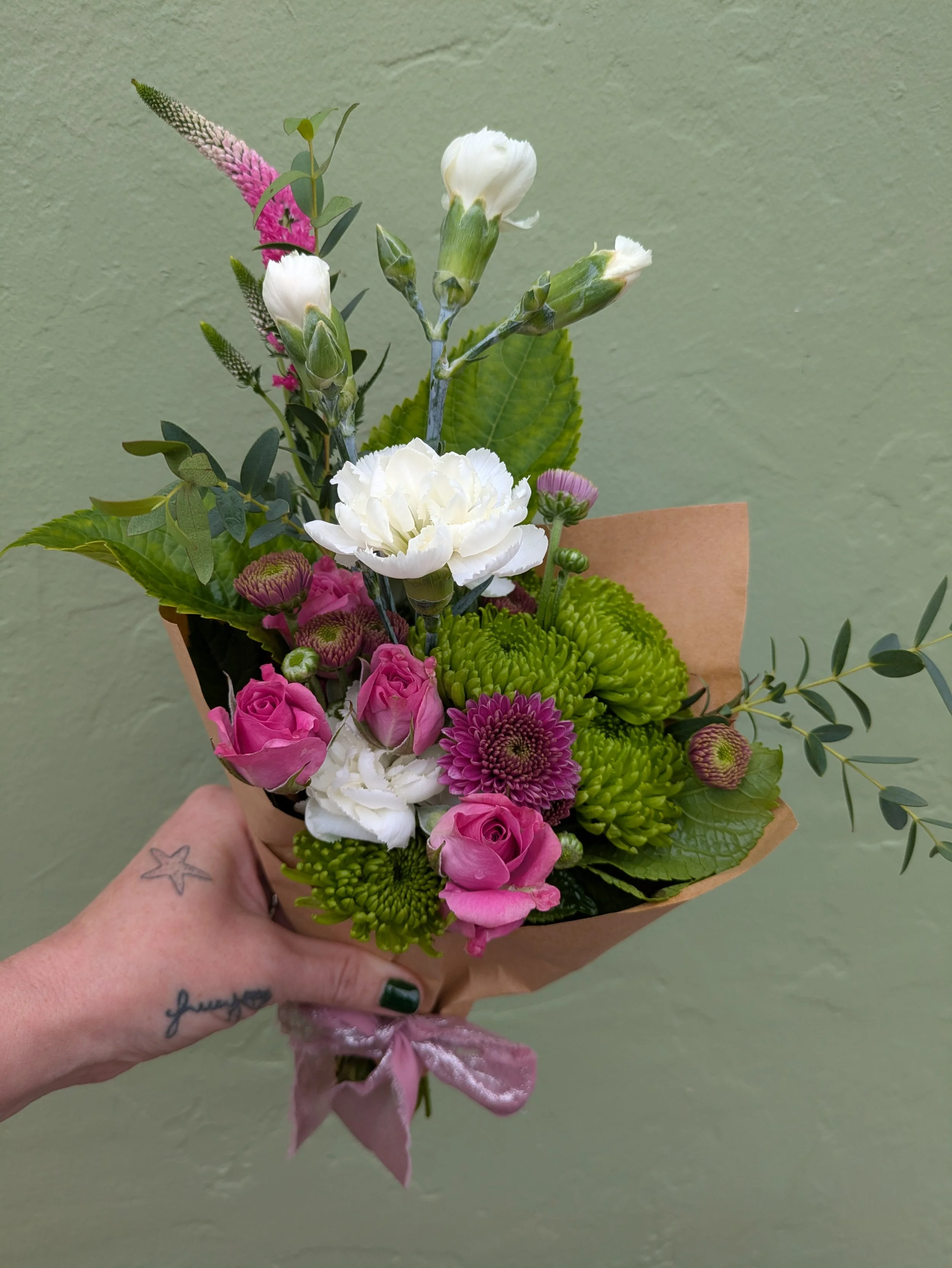 Pink Rose white Carn holding.jpg