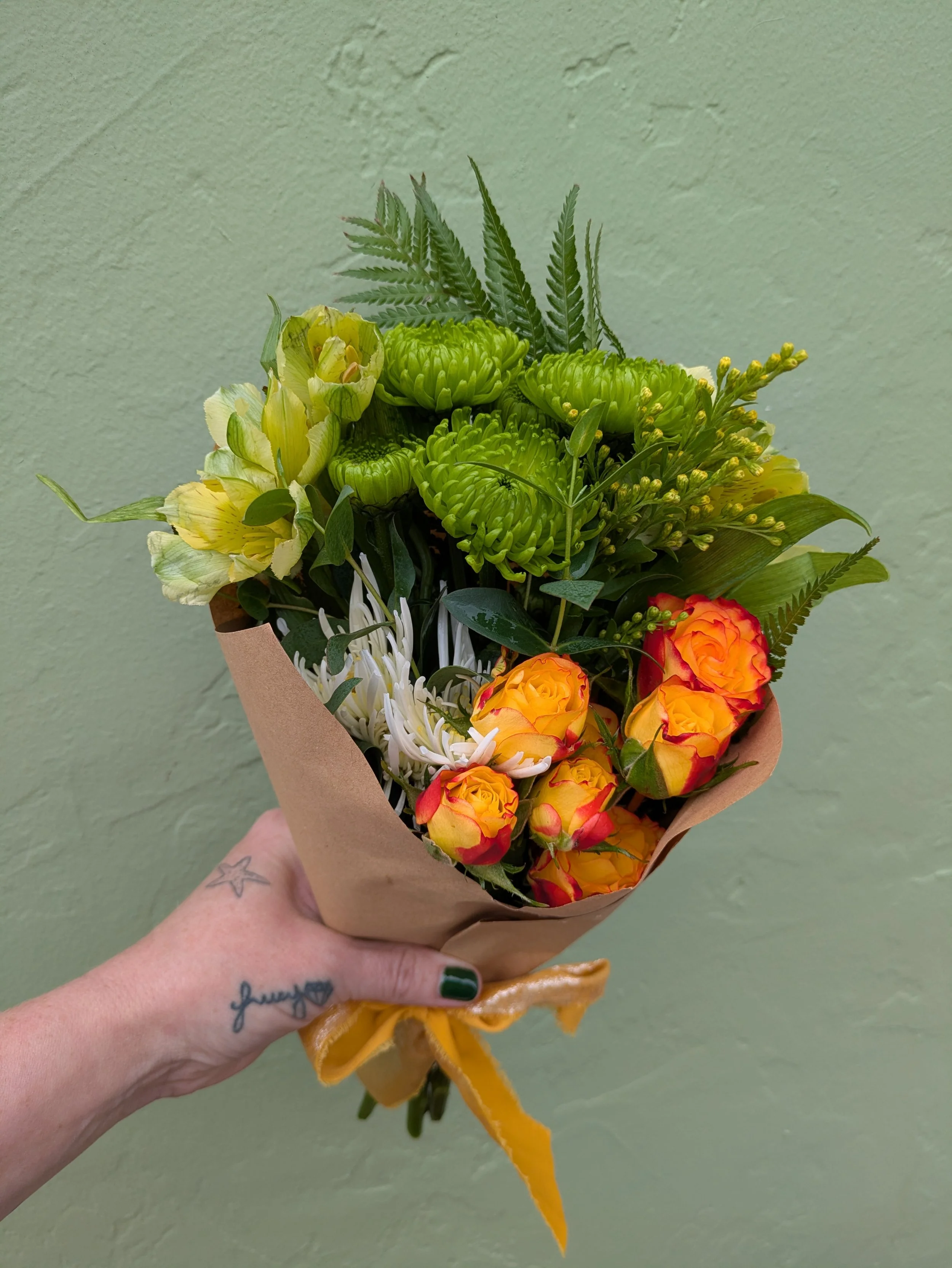 Orange rose holding.jpg
