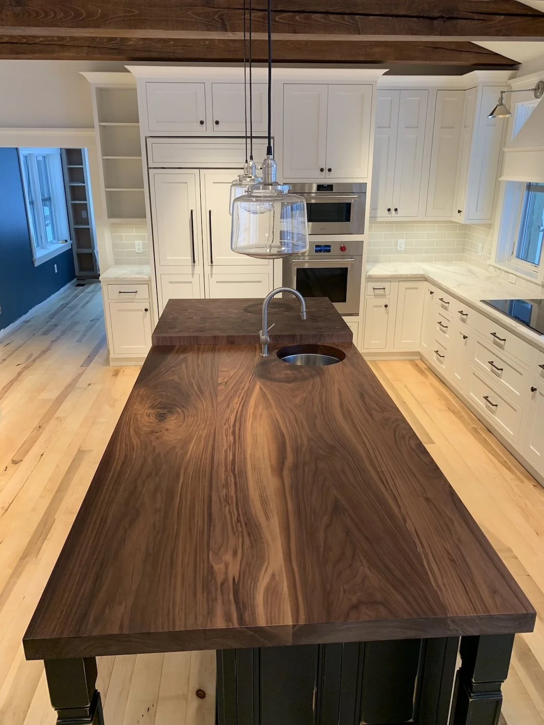 Custom walnut kitchen island countertop by Red Mountain Construction in East Dorset, Vermont