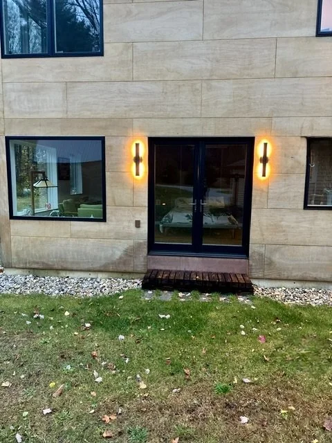 Exterior patio door and window detail of mid-century modern home addition in Arlington, Vermont