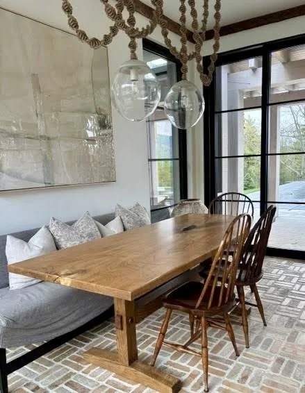 Custom walnut dining table by Red Mountain Construction in East Dorset, Vermont