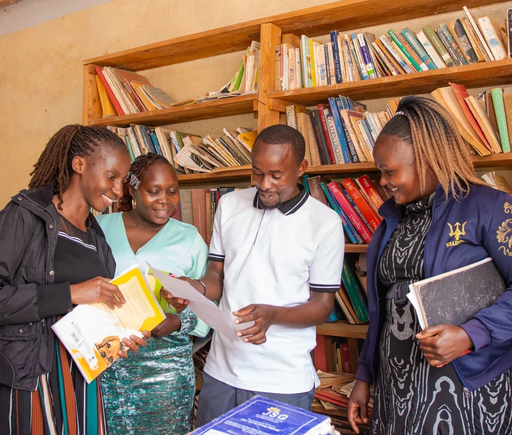 Kiteta Primary school teachers reviewing a document.