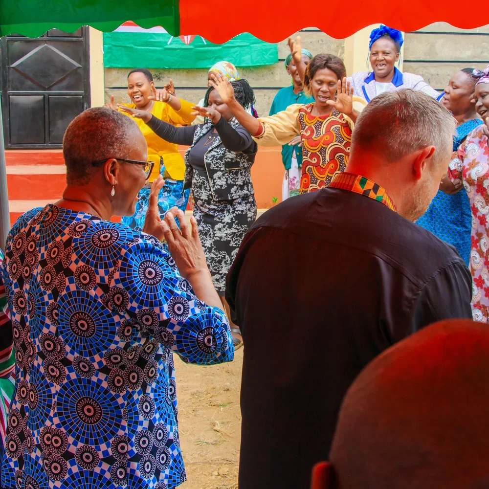 Community members and SMG representatives at the opening of Ndithini Vocational School in June 2026 dancing and celebrating.