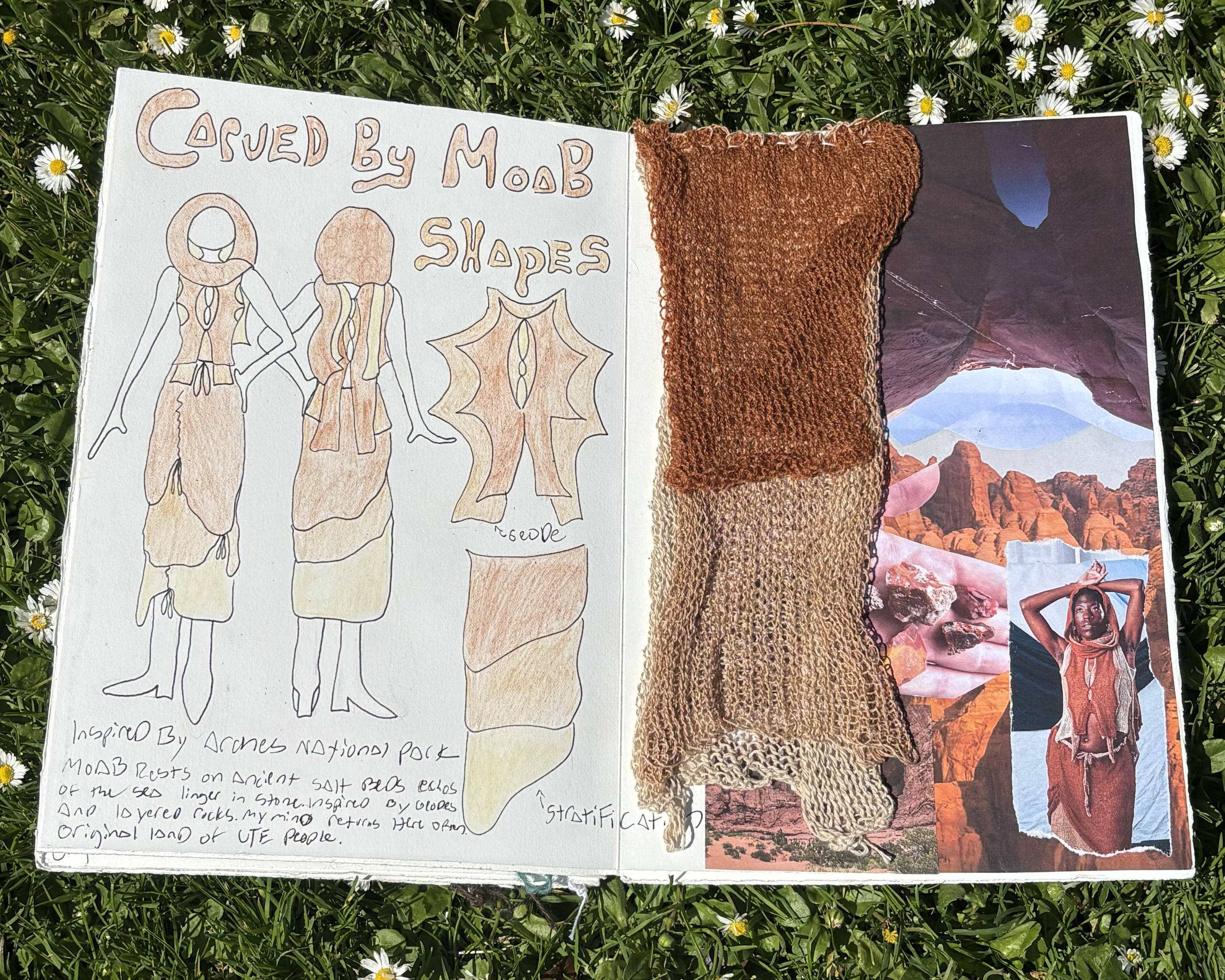 A sketchbook held open on grass, featuring a hand-drawn illustration titled 'Carved by MOB', depicting stylized human figures and a geometric shape. Next to it, a photograph of a desert landscape with rock formations and a person wearing a pink scarf