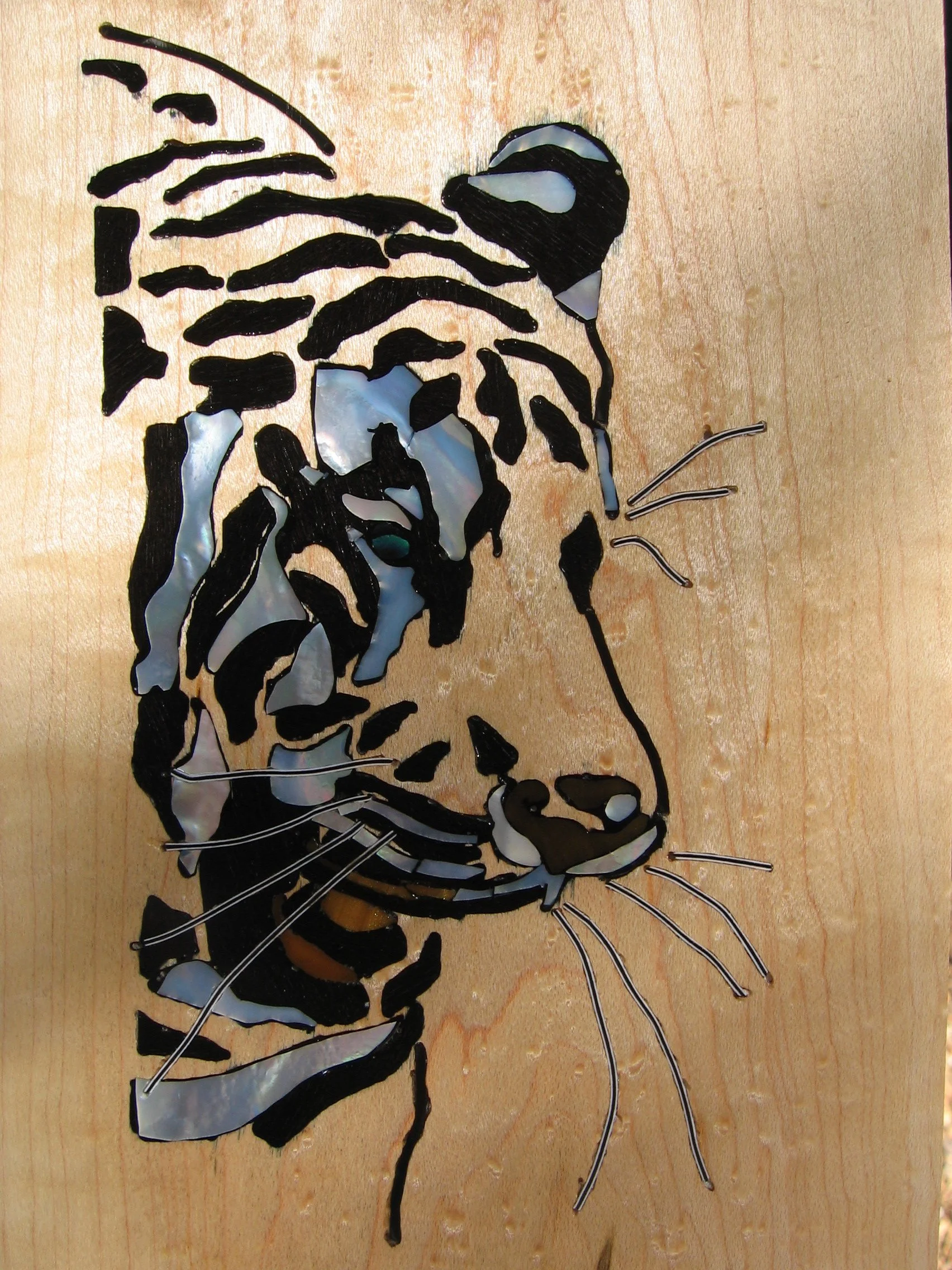 Maple headstock with Tiger Inlay for carved archtop guitar, using mother of pearl, ebony. By Elaine Moulton, luthier, Immortal Guitars.