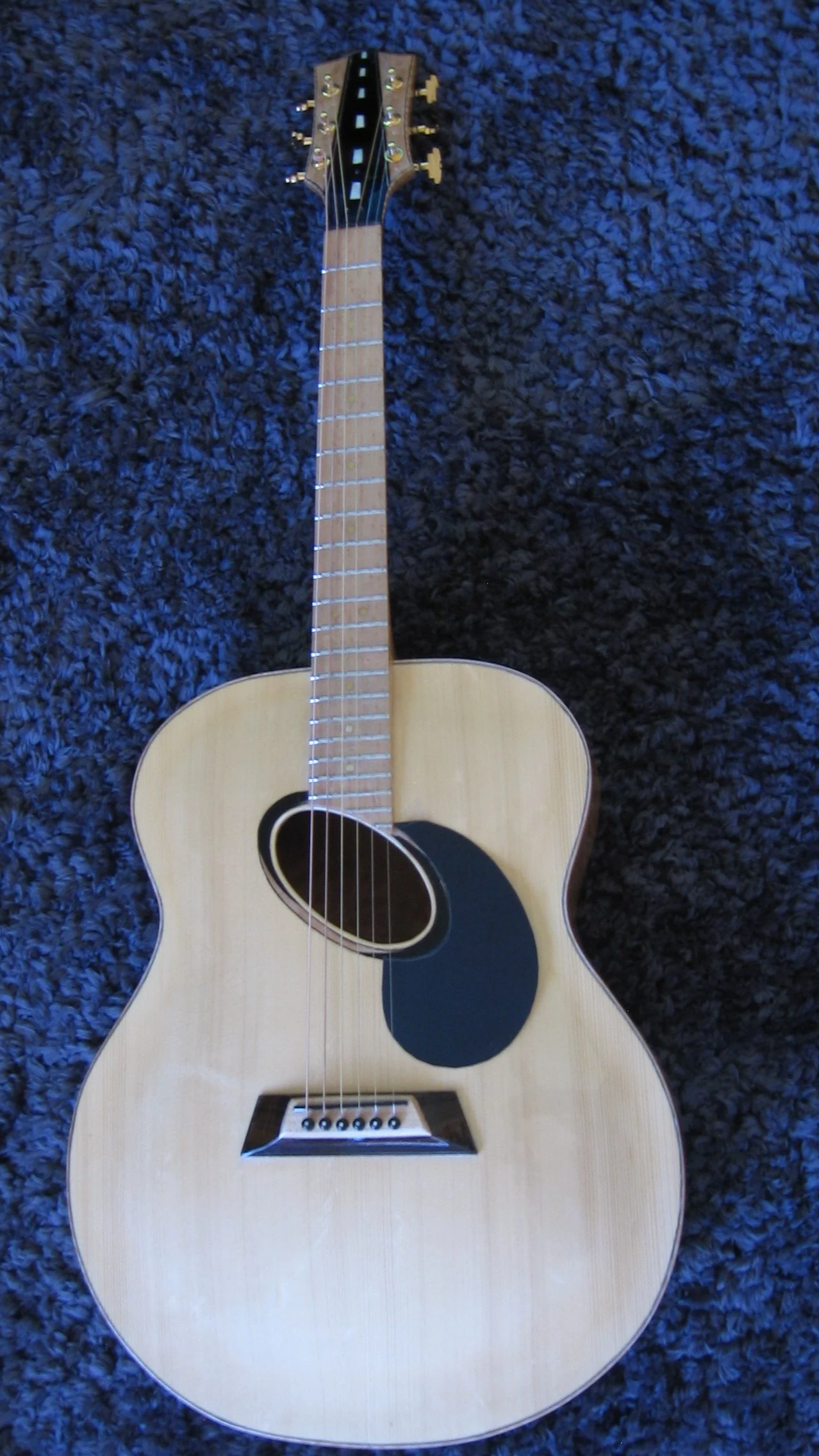 Acoustic hand carved archtop with fixed bridge. AAAA maple back & sides, maple fingerboard, custom made, one of a kind. Inlay of ebony, mother of pear, & herringbone. Made by Elaine Moulton, luthier. Immortal Guitars. 