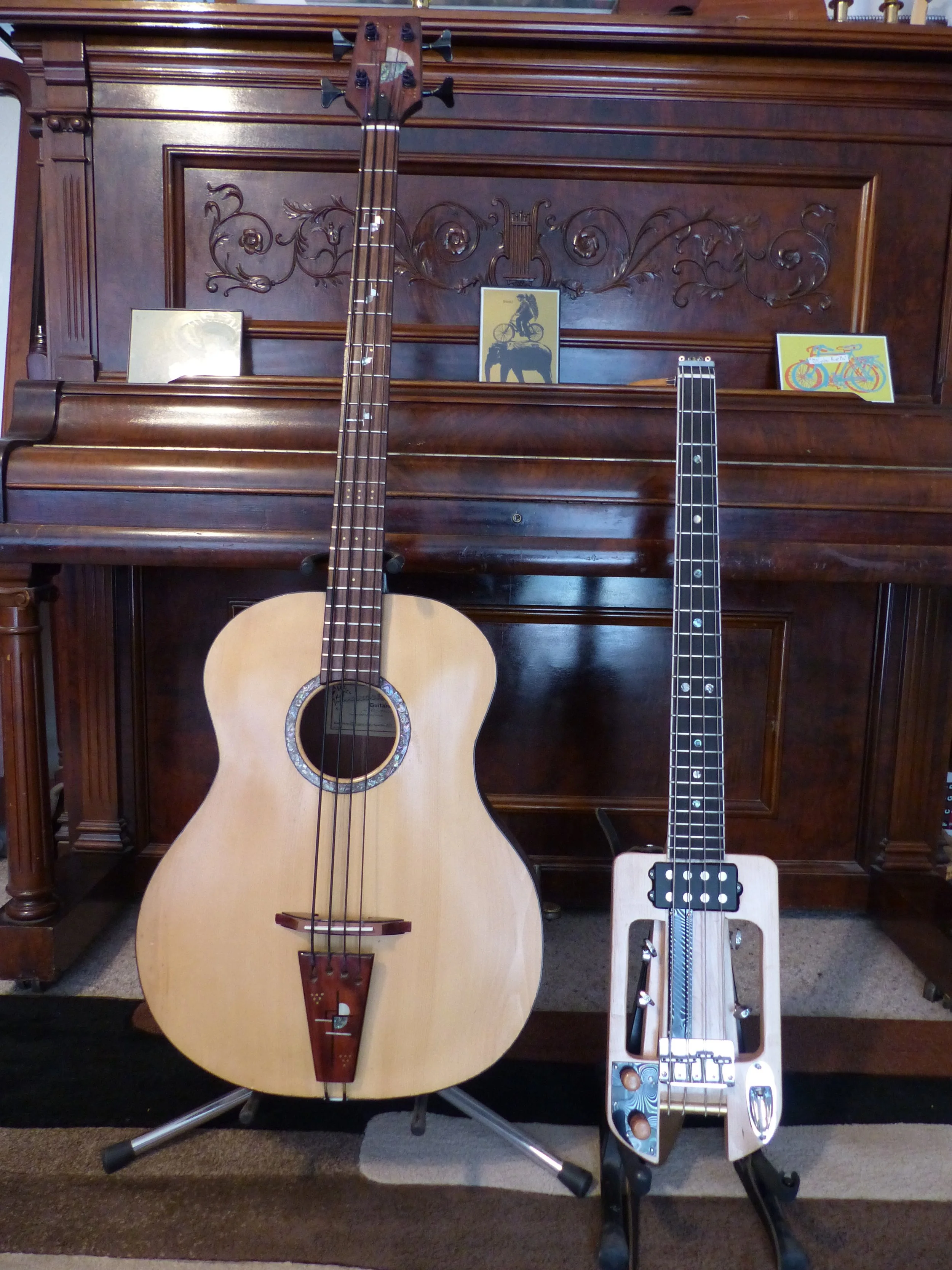 Hand carved acoustic bass, one of a kind, top plate spruce, back and sides from cocobolo, abalone inlay around soundhole, custom inlay on tailpiece and headstock, modern design inlay. Made by Elaine Moulton, luthier  at Immortal Guitars. Bass travel 