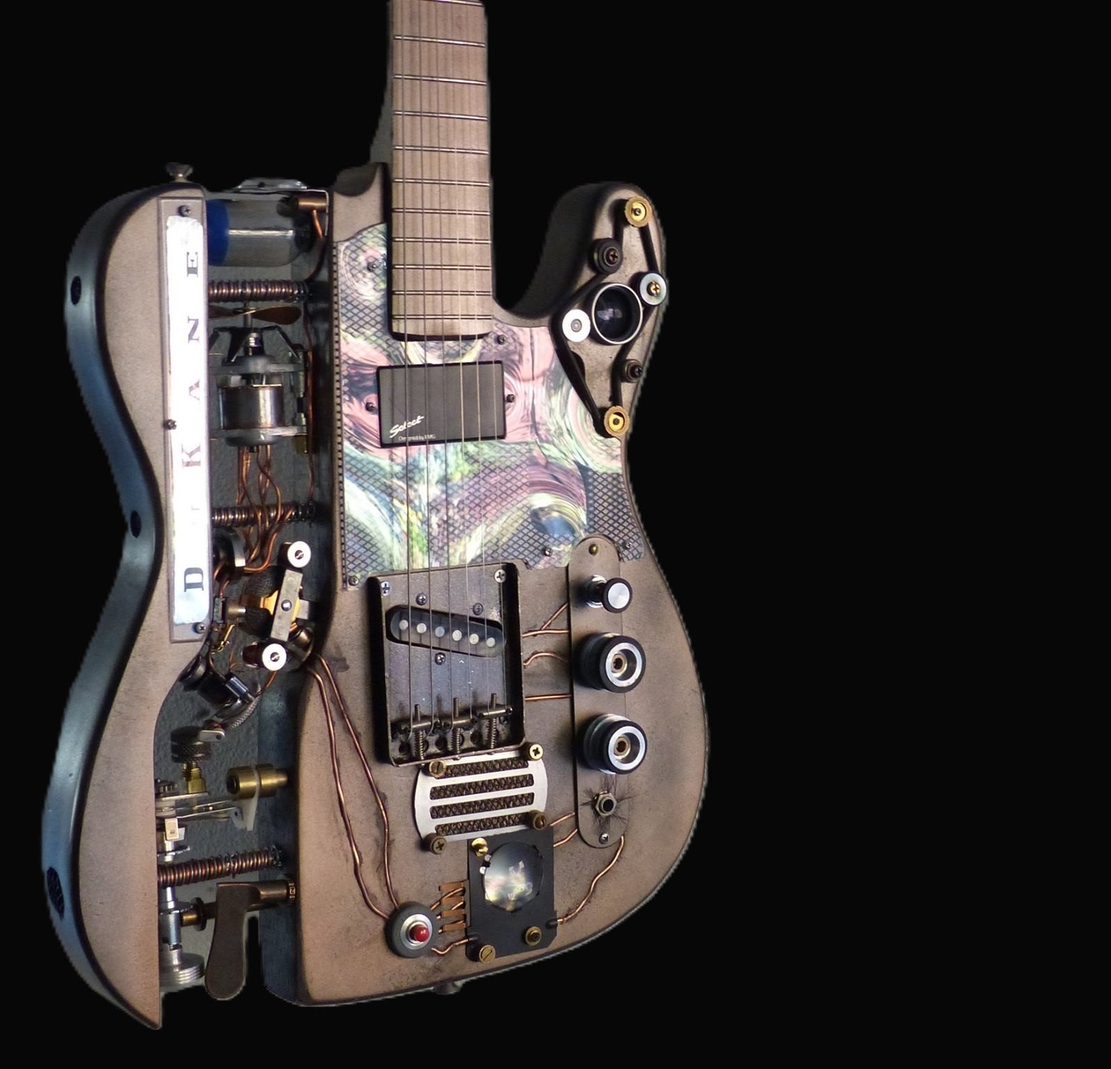Steampunk Guitar using parts from a Dukane projector. inset propellers, wiring, electric. Made by Mike Moulton at Immortal Guitars.