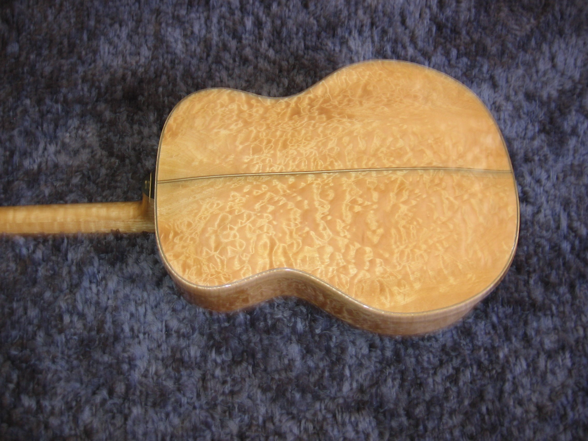 AAAA grade maple back on custom carved archtop guitar by Elaine Moulton, luthier at Immortal Guitars
